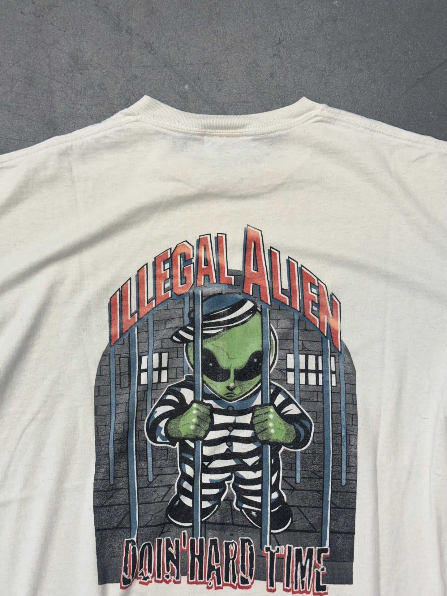 90'S VISITOR X ILLEGAL ALIEN DOIN' HARD TIME TEE (ONEITA TAG)