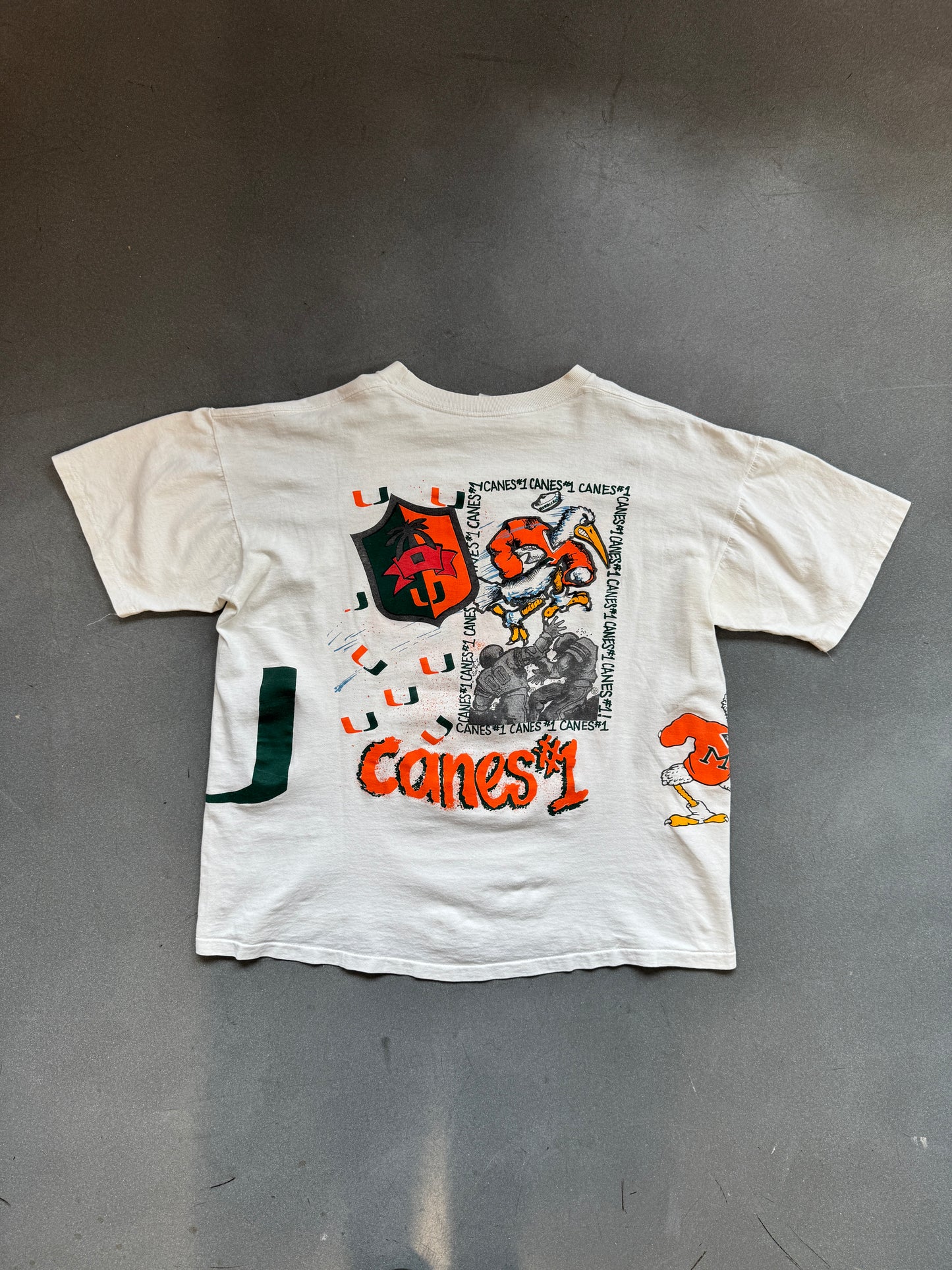 90'S UNIVERSITY OF MIAMI HURRICANES SEBASTIAN IBIS WRAP AROUND FOOTBALL #1 CANES TEE (FADED TAG)