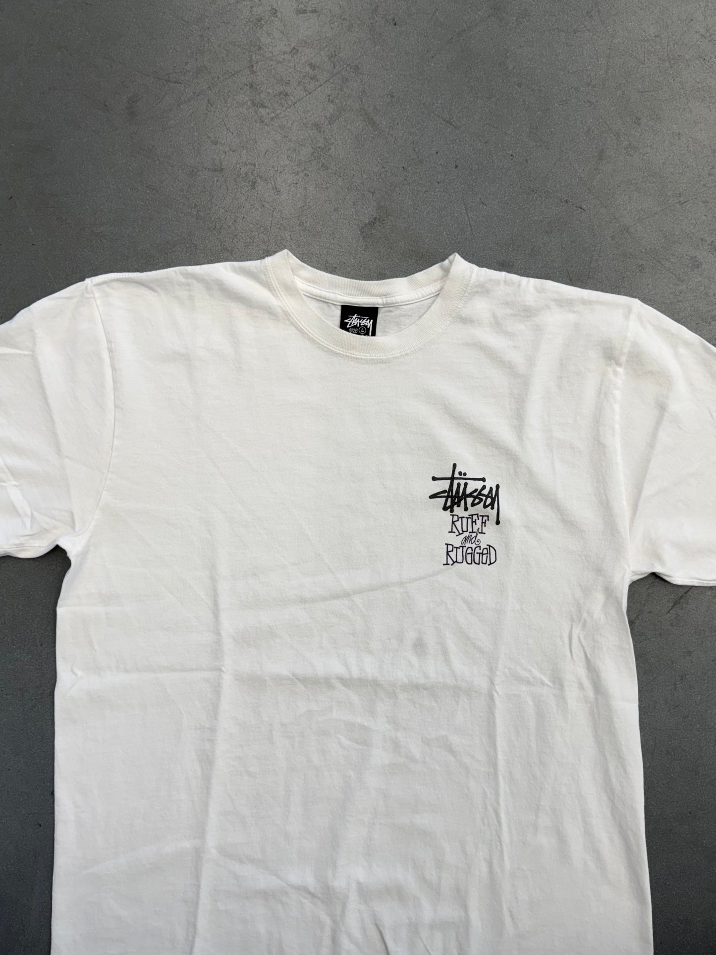 SS25 STUSSY WELL SUITED FOR THIS RUFF AND RUGGED WORLD TEE
