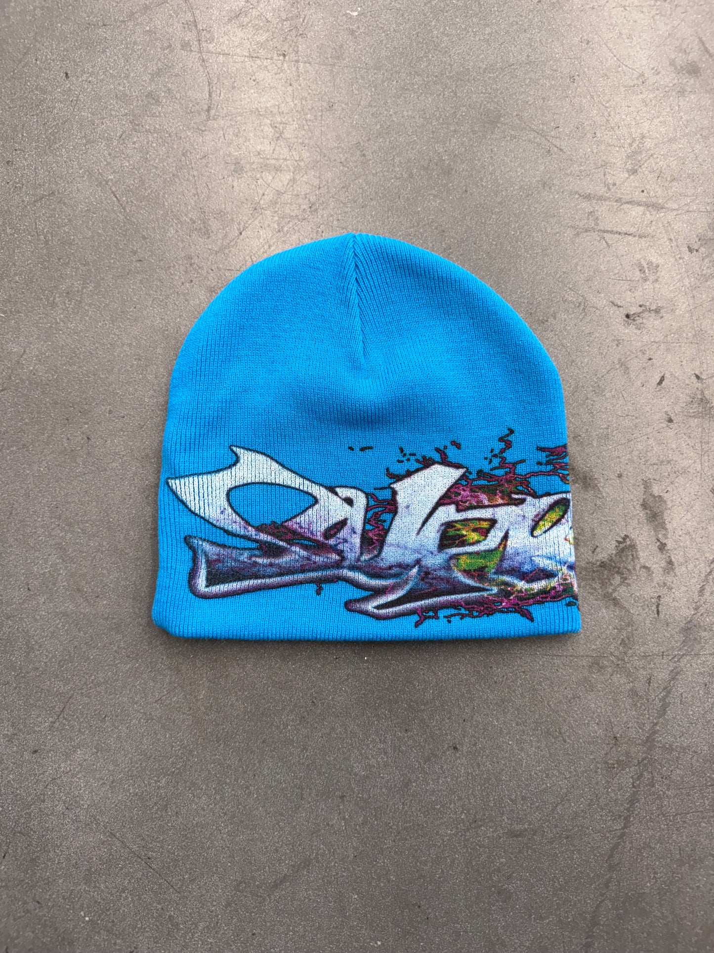 FW25 SUPREME TAG BEANIE (NEW IN REPLACEMENT BAG)