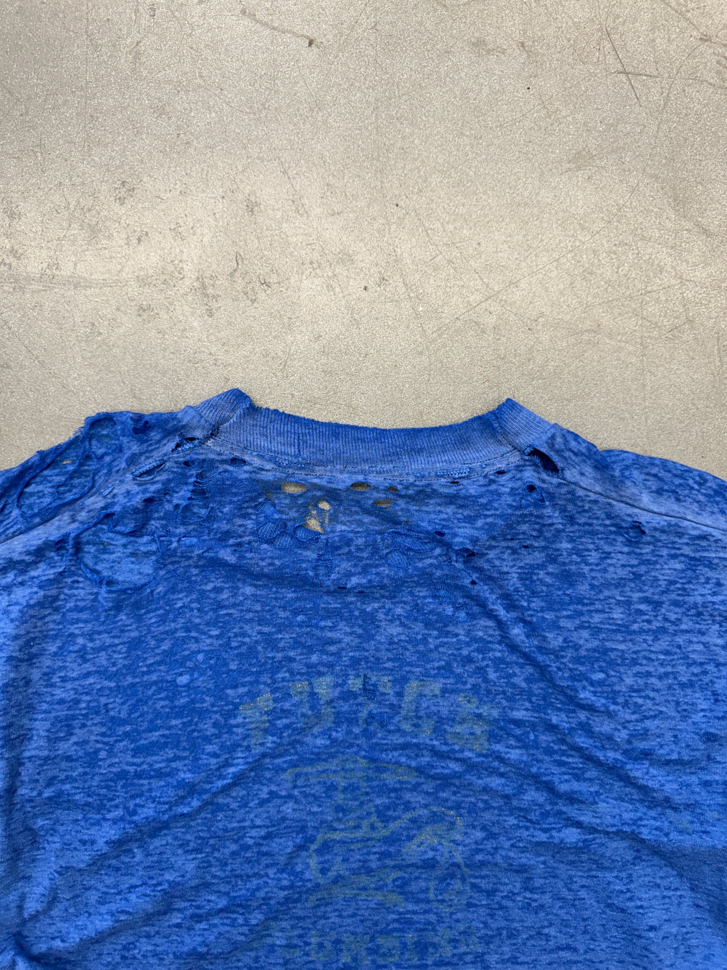 VINTAGE THRASHED THIN BLUE TEE WITH YELLOW LETTERS ON BACK (PULLED TAG)