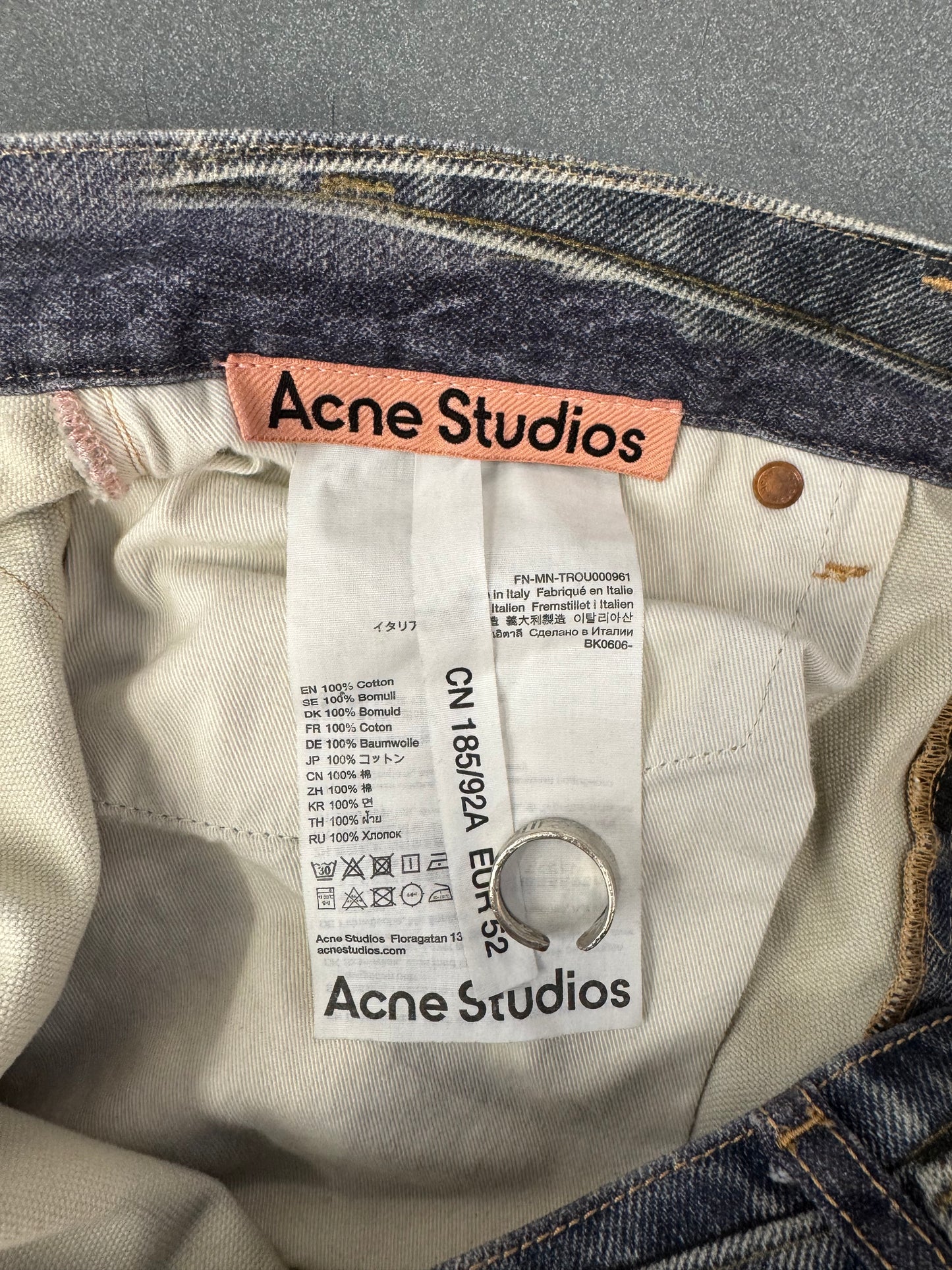 ACNE STUDIOS LEATHER CHAPS PRINTED JEANS