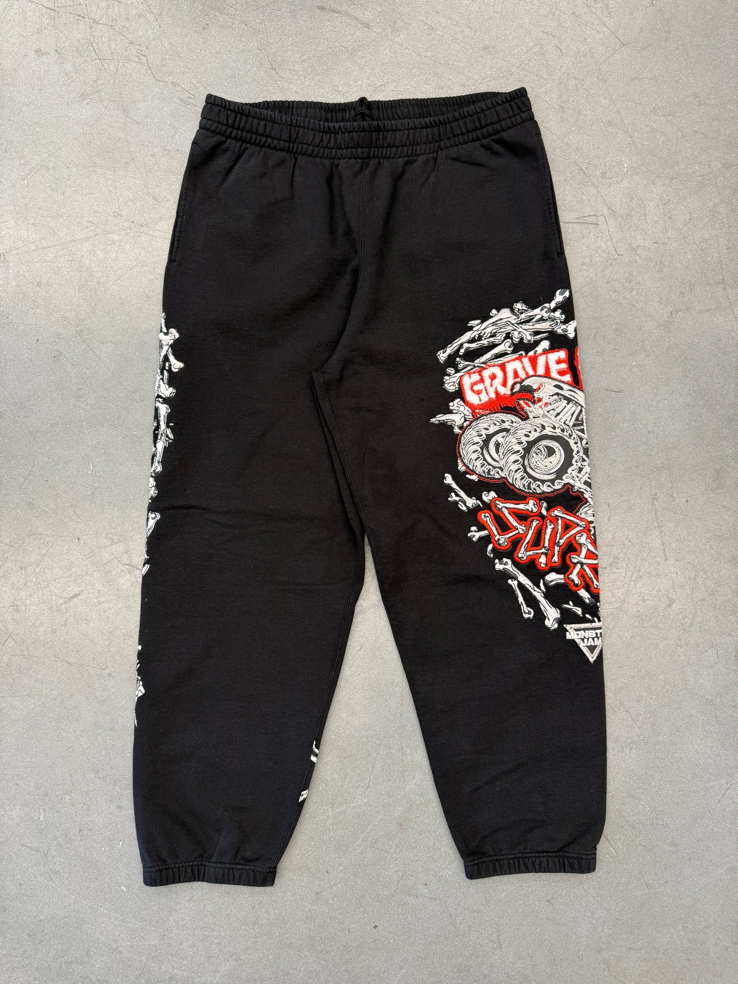 SS26 SUPREME MONSTER JAM GRAVE DIGGER BONES SWEATPANTS