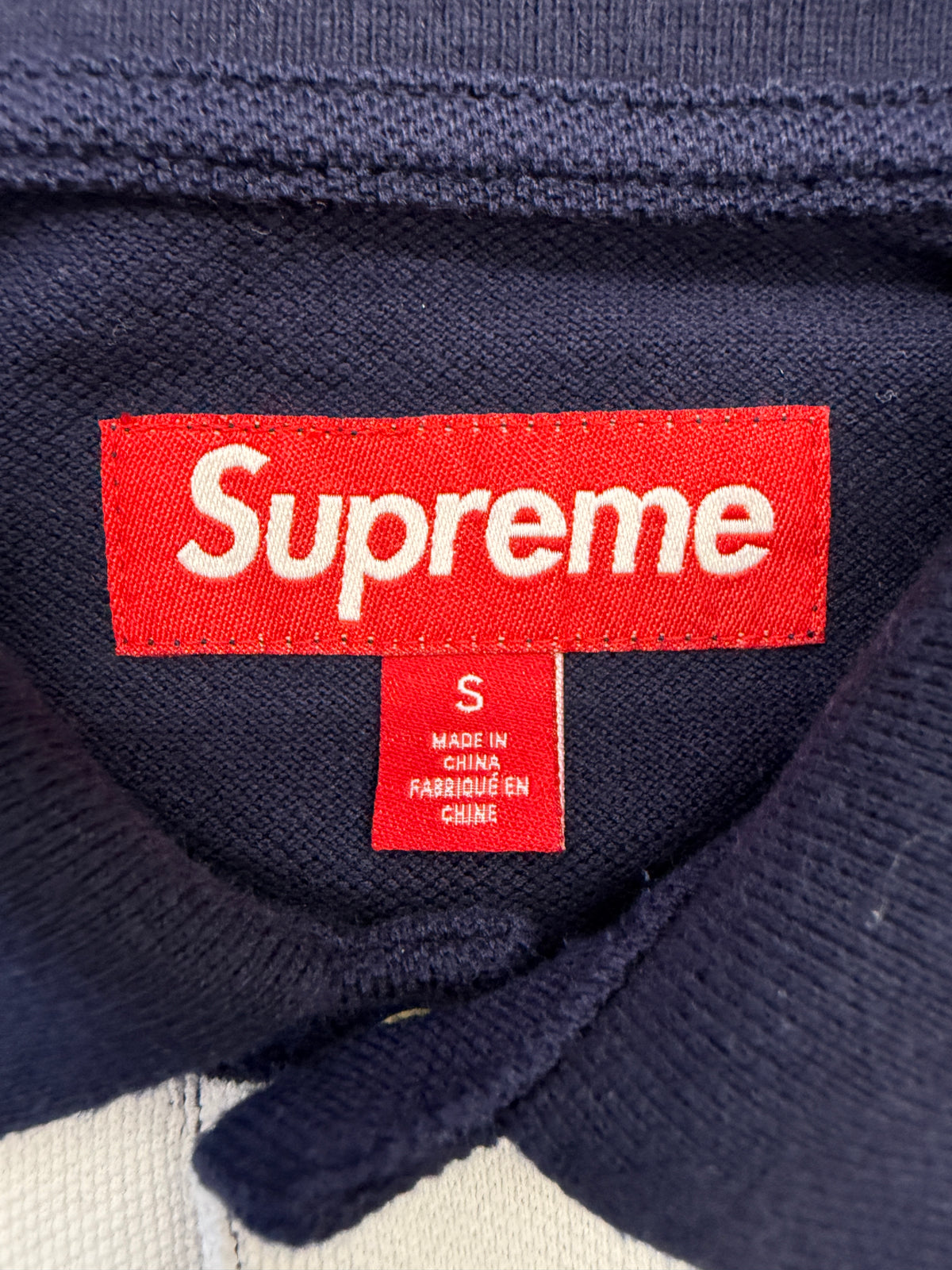 SS25 SUPREME CURSIVE POLO SHIRT - NAVY STRIPE