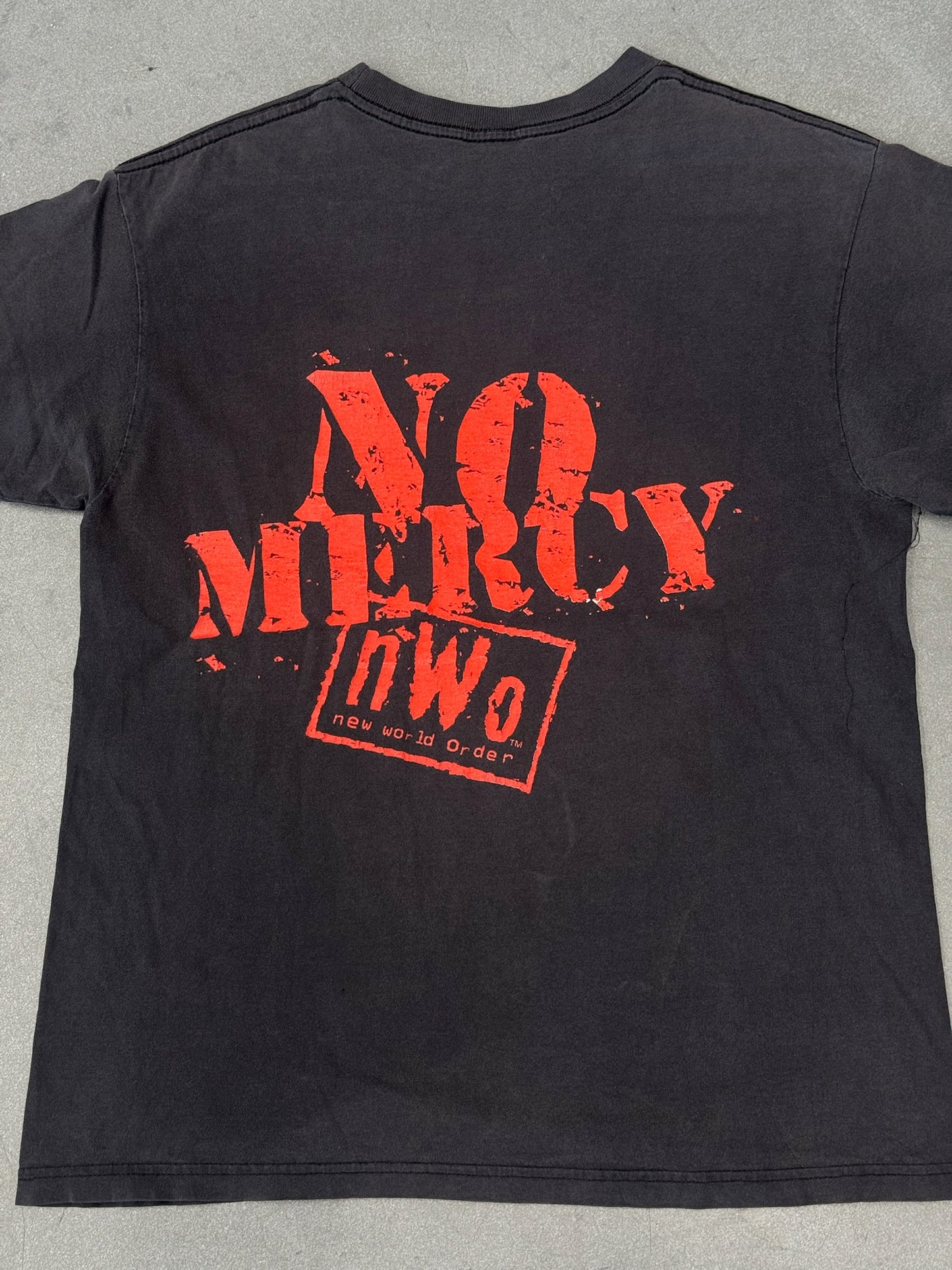 90S NWO NEW WORLD ORDER NO MERCY TEE (FADED PLANET TAG)