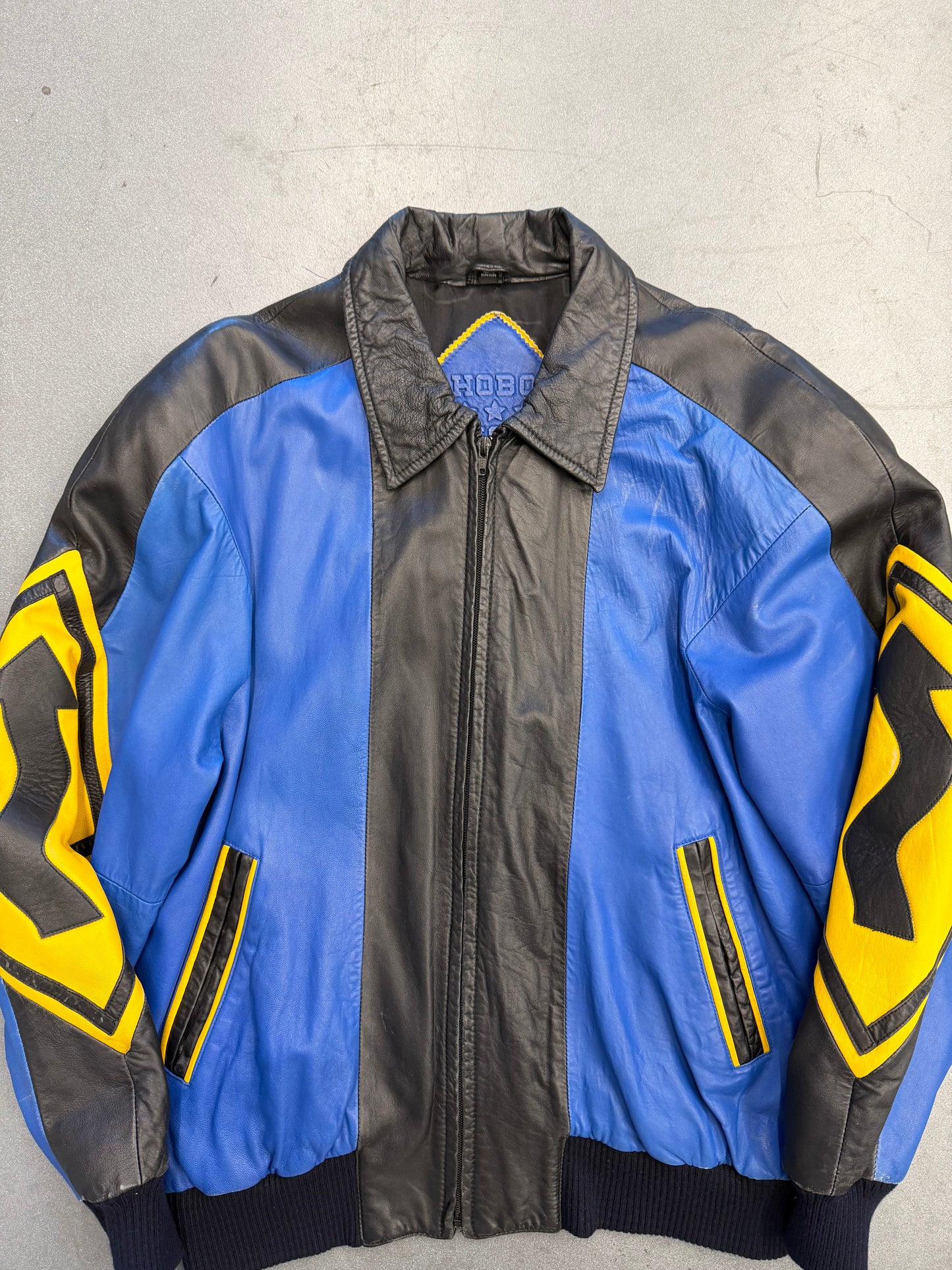 VINTAGE MICHAEL HOBAN NORTH BEACH STREET SIGN LEATHER JACKET - BLUE/YELLOW (S)