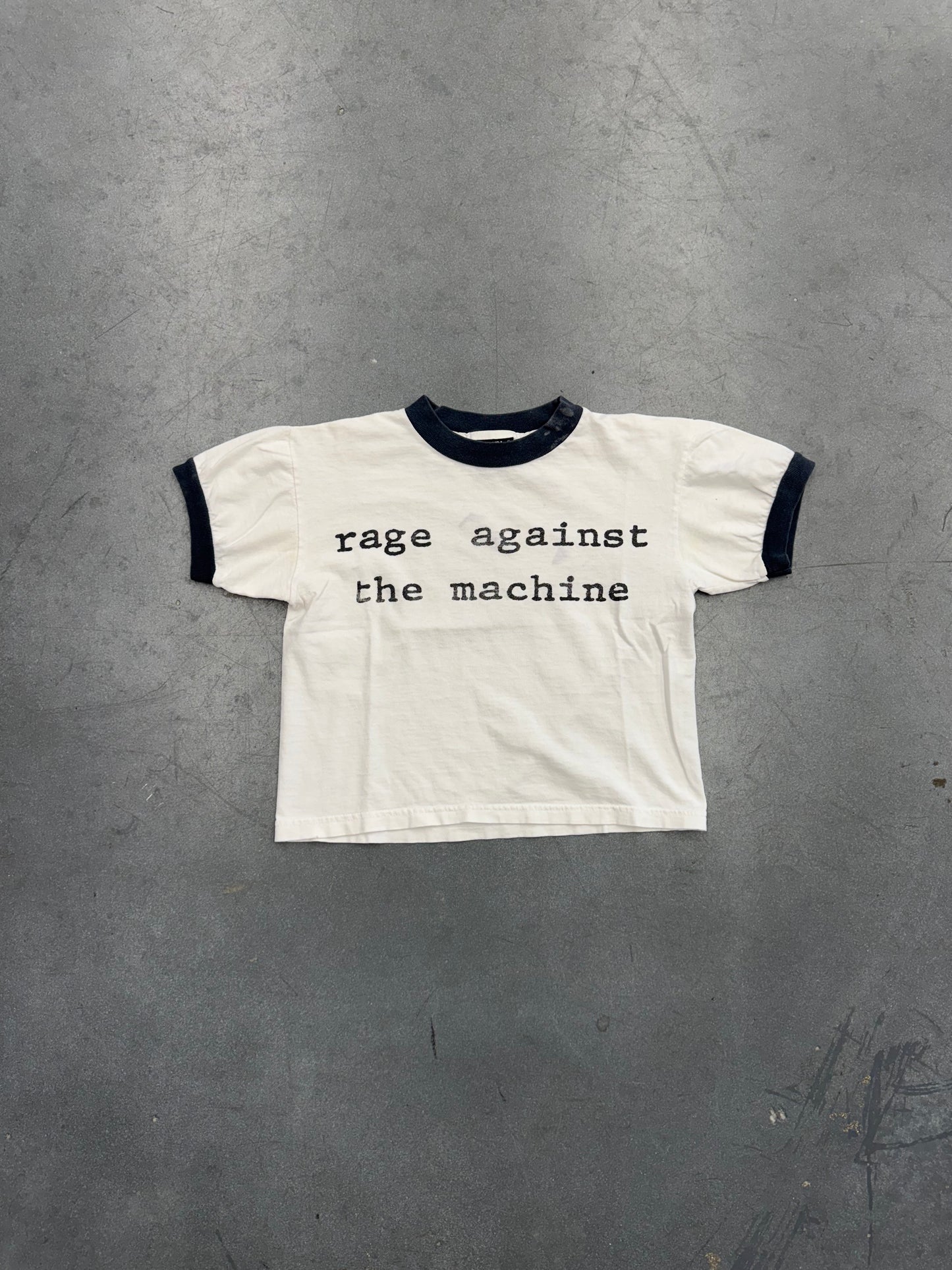 90S RAGE AGAINST THE MACHINE UNITED NATIONS REPORT BABY RINGER TEE (GIANT TAG)