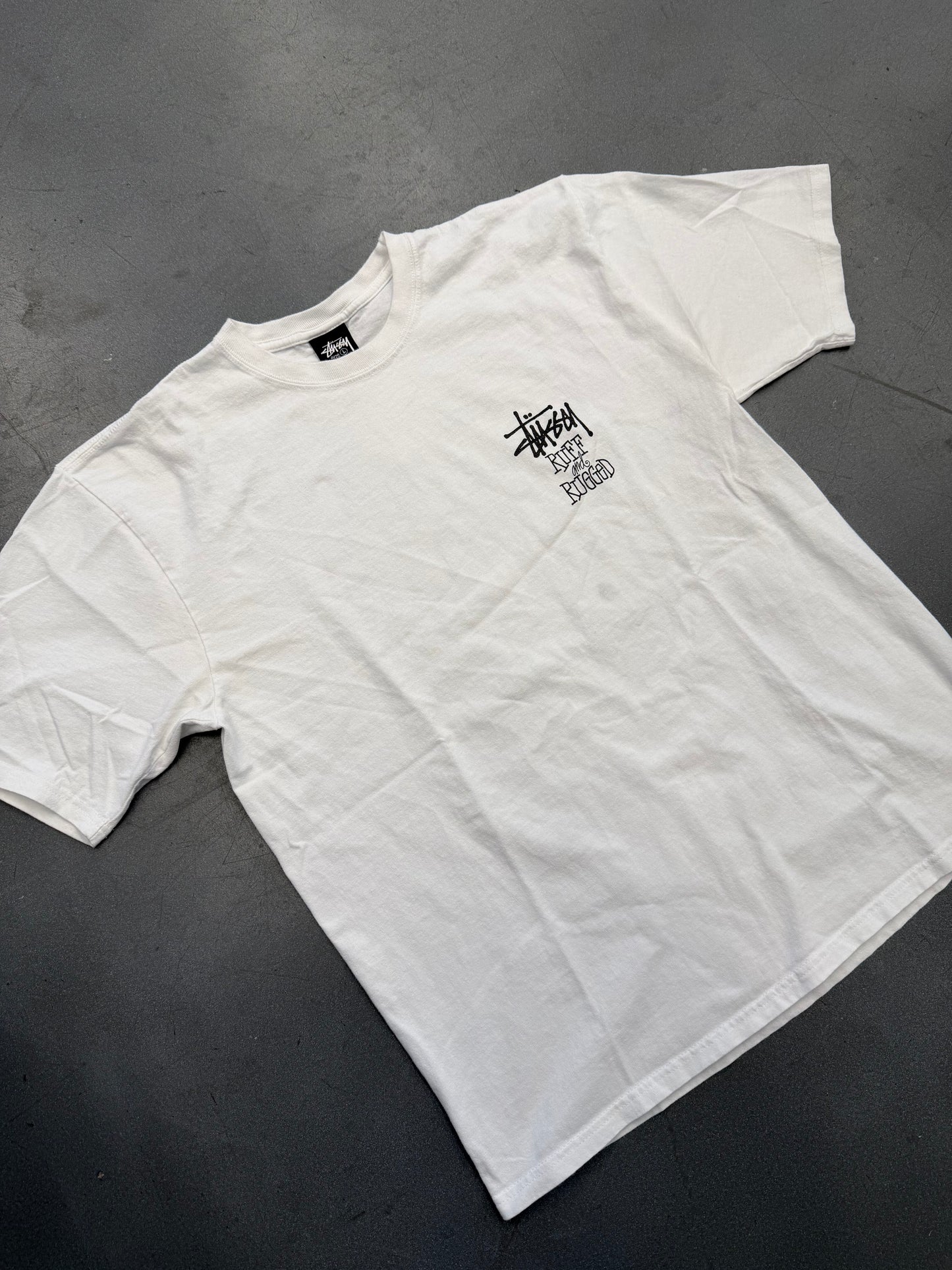 SS25 STUSSY WELL SUITED FOR THIS RUFF AND RUGGED WORLD TEE