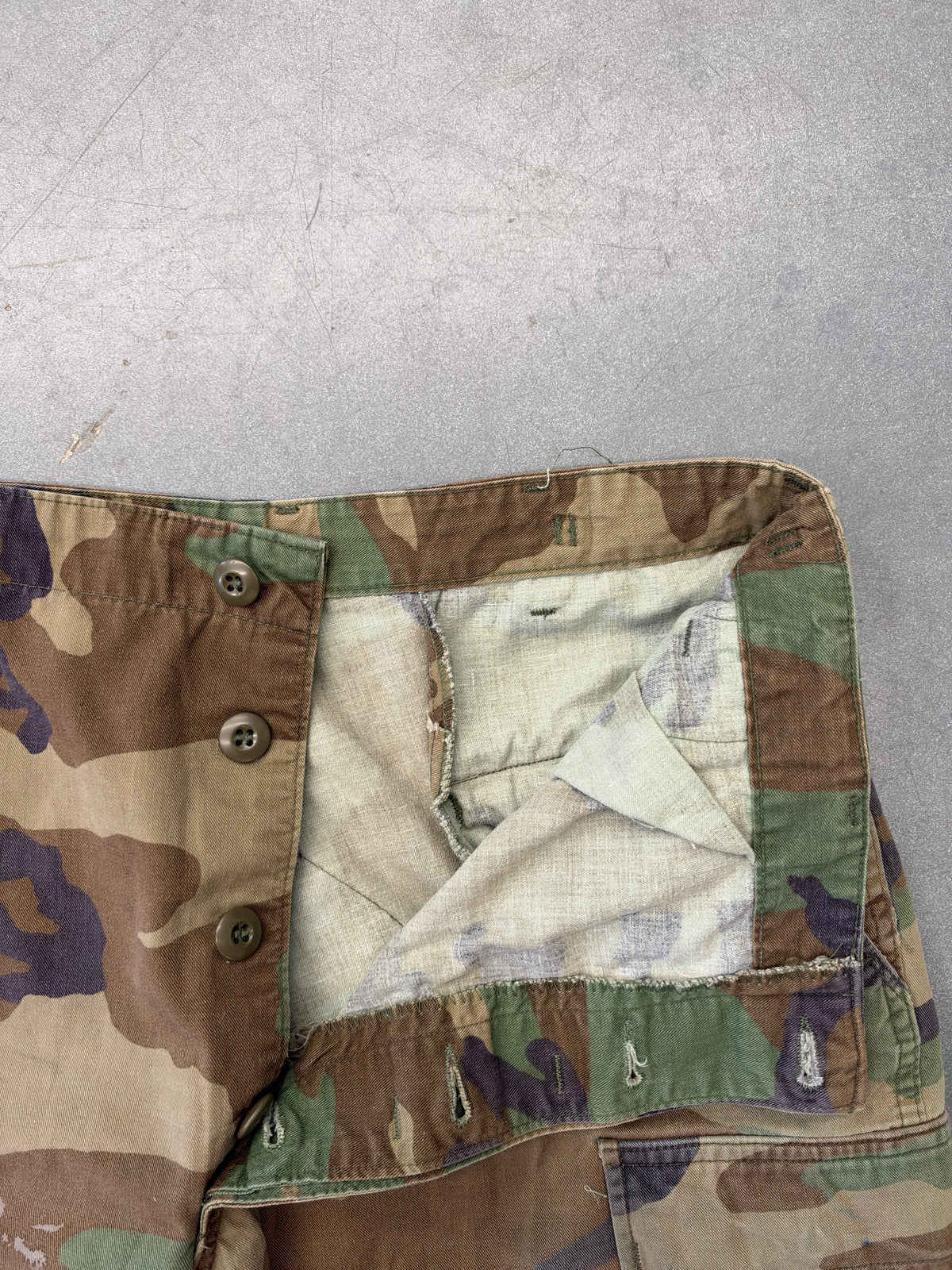 VINTAGE WOODLAND CAMO CARGO PANTS CUT TO LONG SHORTS (FADED TAG)