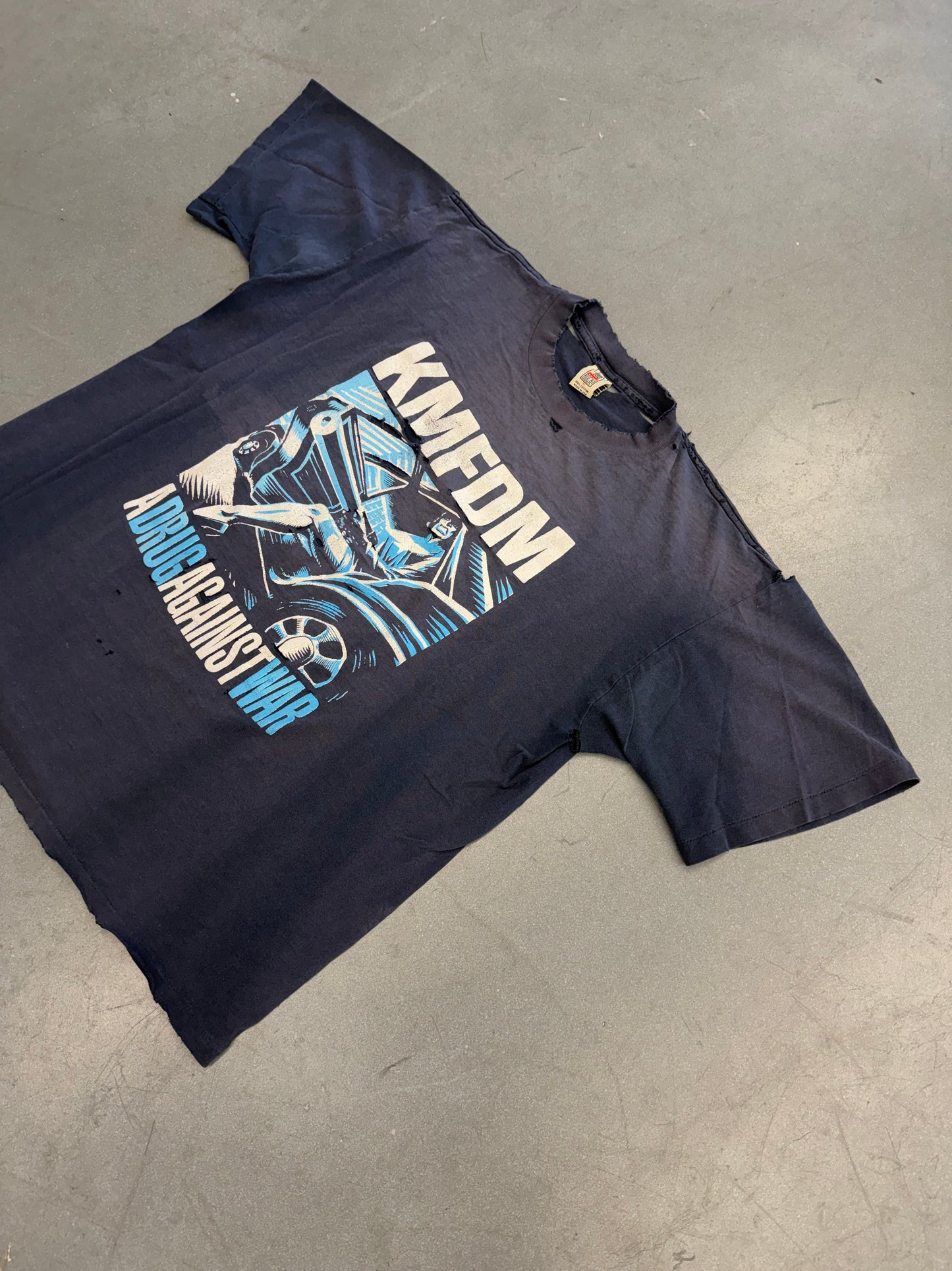 KMFDM A DRUG AGAINST WAR TEE (JUST SAY ROCK TAG)