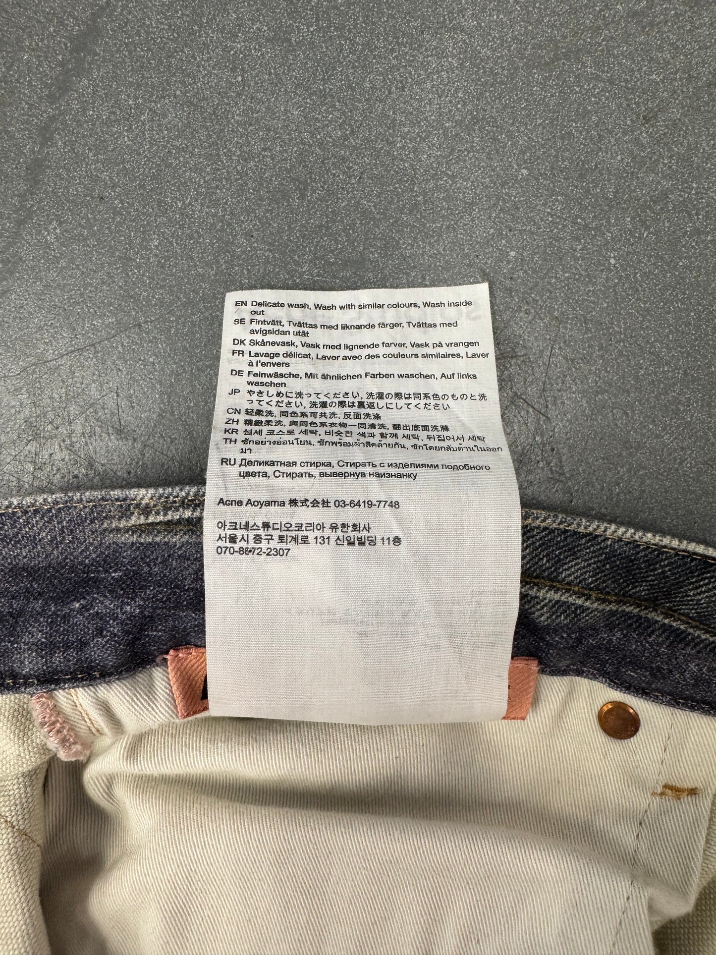 ACNE STUDIOS LEATHER CHAPS PRINTED JEANS