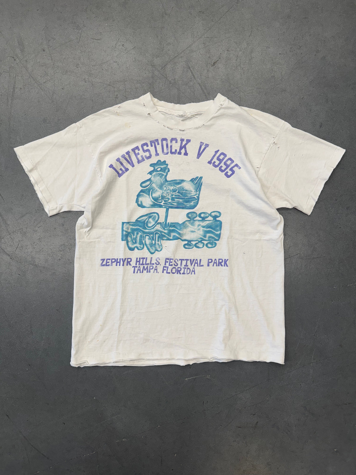 1995 LIVESTOCK V ZEPHYRHILLS FESTIVAL PARK THRASHED AND REPAIRED TEE (CUT FOTL TAG)