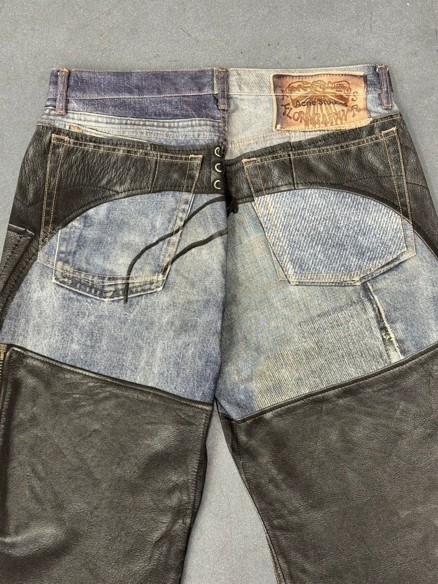 ACNE STUDIOS LEATHER CHAPS PRINTED JEANS