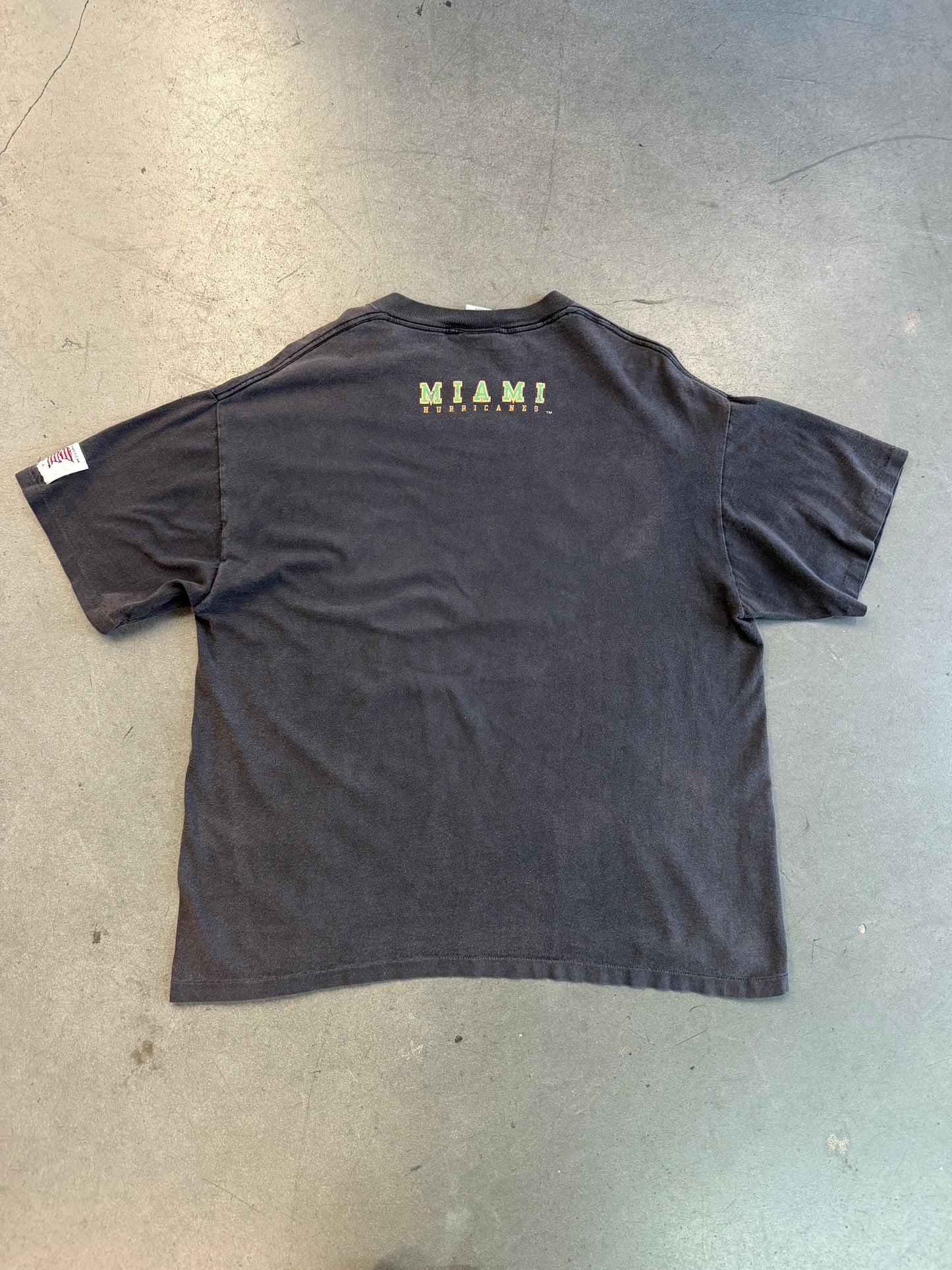 1994 MIAMI HURRICANES SEBASTIAN BASKETBALL BREAKTHROUGH SHATTERED TEE (ACTIVE IMAGE TAG)