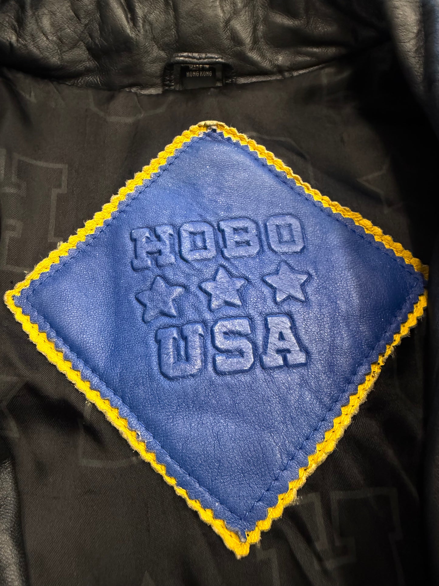 VINTAGE MICHAEL HOBAN NORTH BEACH STREET SIGN LEATHER JACKET - BLUE/YELLOW (S)