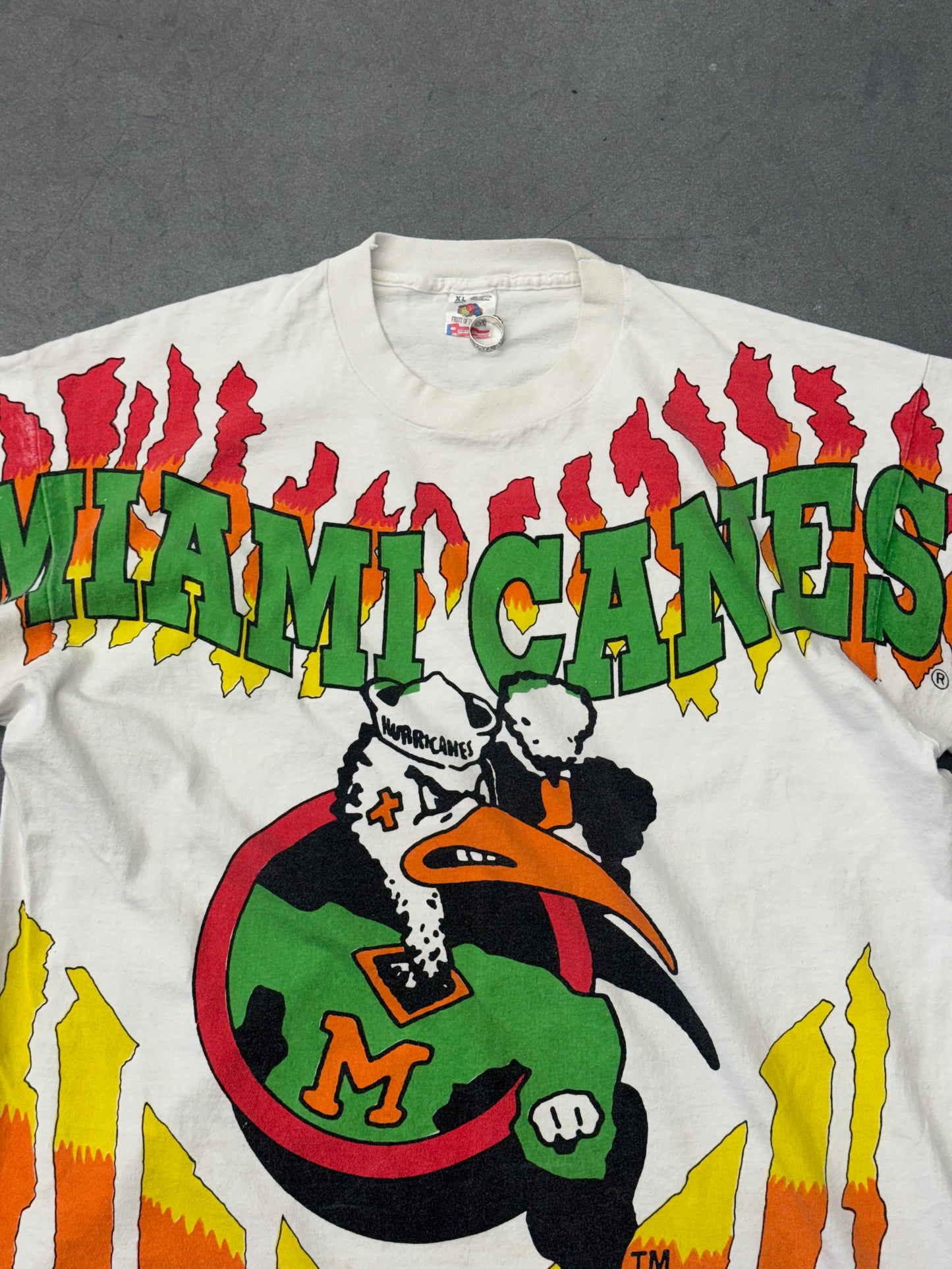 90S UNIVERSITY OF MIAMI SEBASTIAN CIRCLE LOGO FLAMES AOP TEE (FOTL TAG)