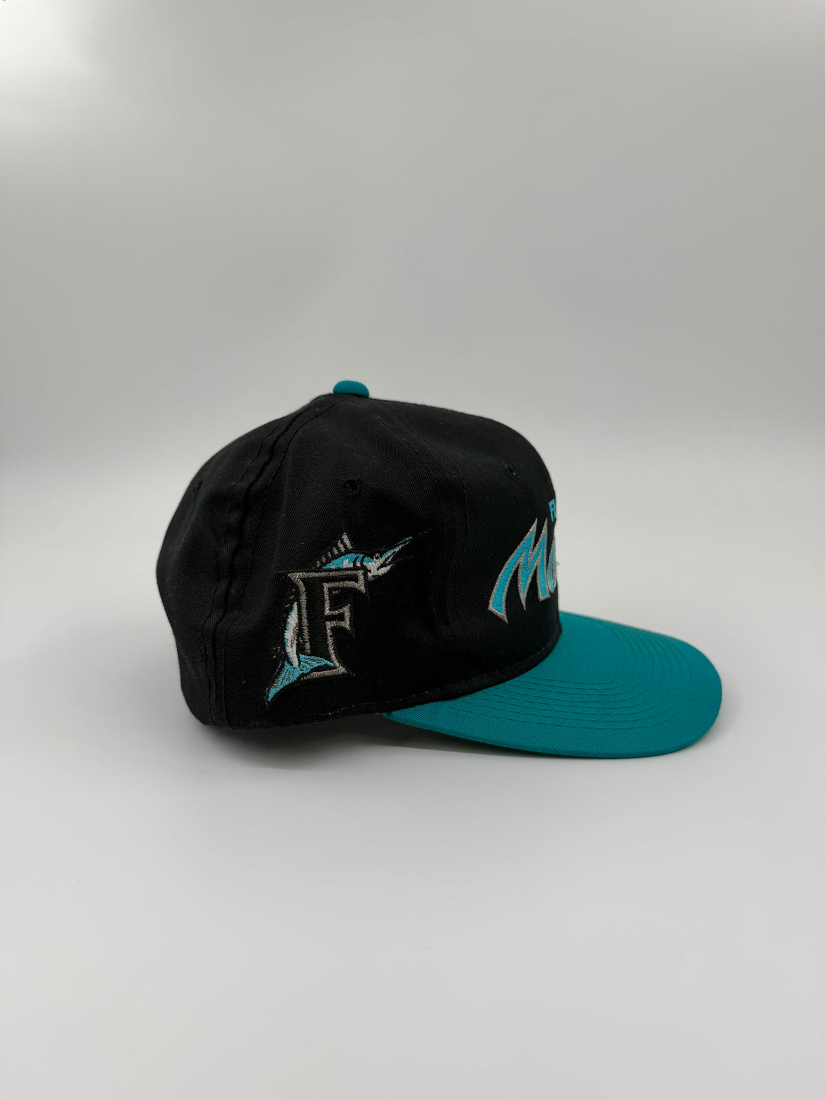 90S FLORIDA MARLINS SCRIPT THE TWILL SPORTS SPECIALTIES SNAPBACK HAT BLACK/TEAL