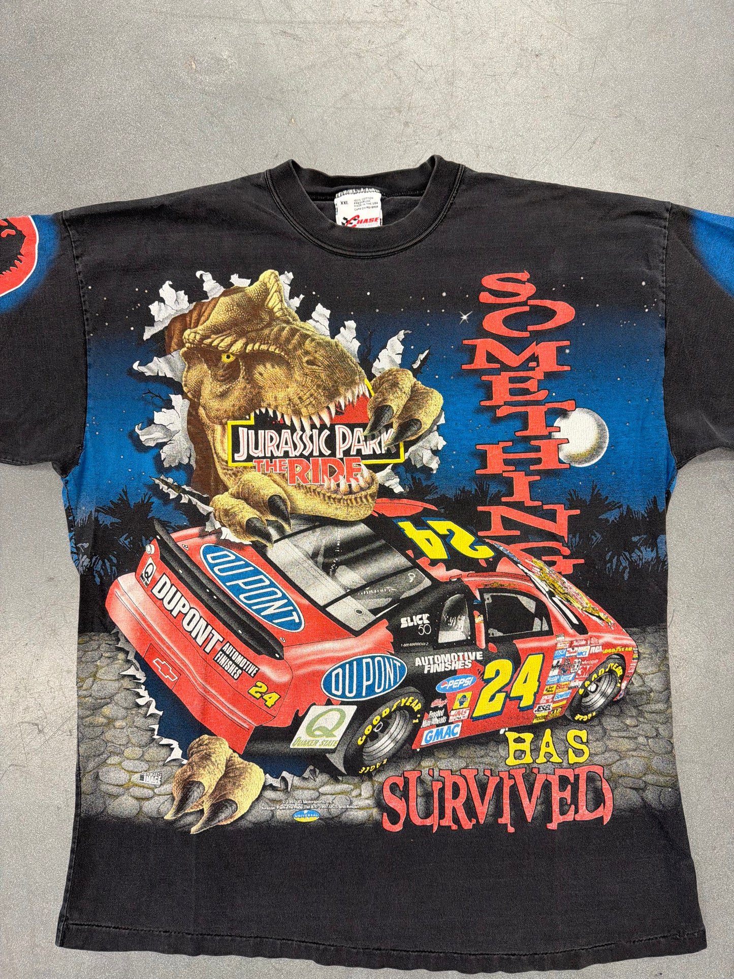 1997 JEFF GORDON JURASSIC PARK THE RIDE SOMETHING HAS SURVIVED AOP (CHASE RACE WEAR TAG)