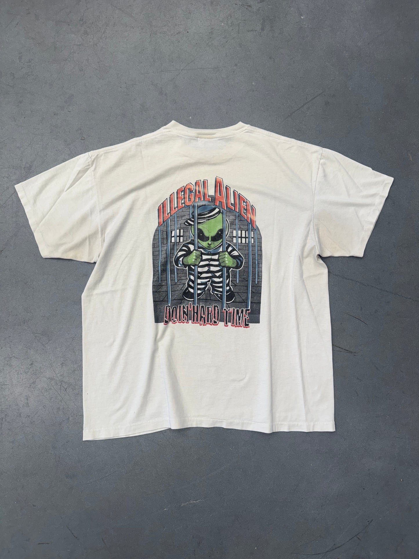 90'S VISITOR X ILLEGAL ALIEN DOIN' HARD TIME TEE (ONEITA TAG)