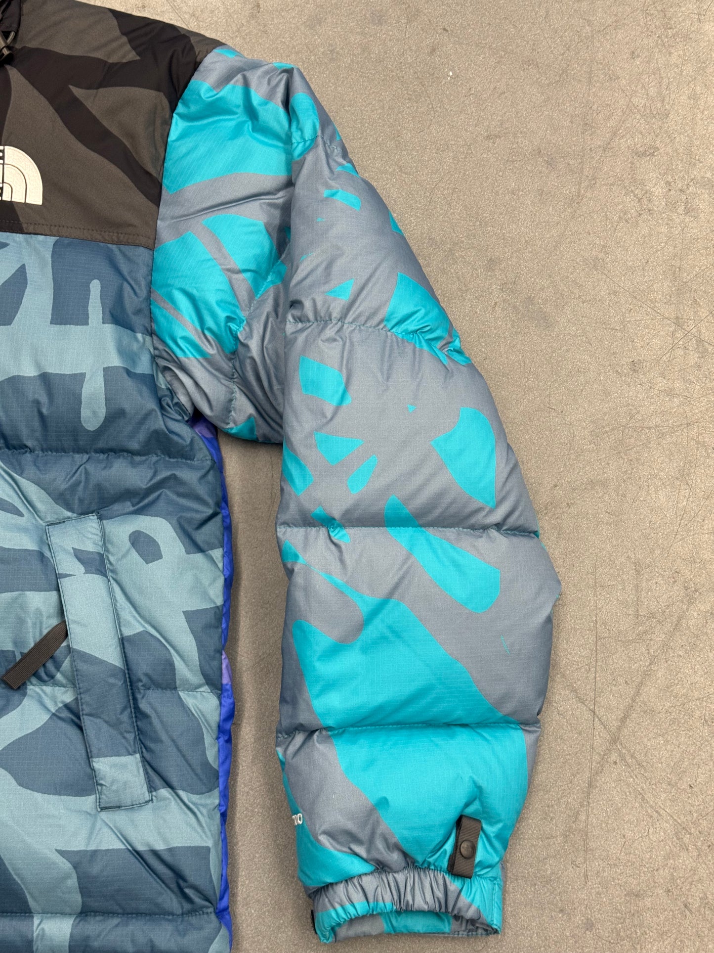 KAWS X THE NORTH FACE RETRO 1996 JACKET - MONTEREY BLUE NUPTSE PRINT