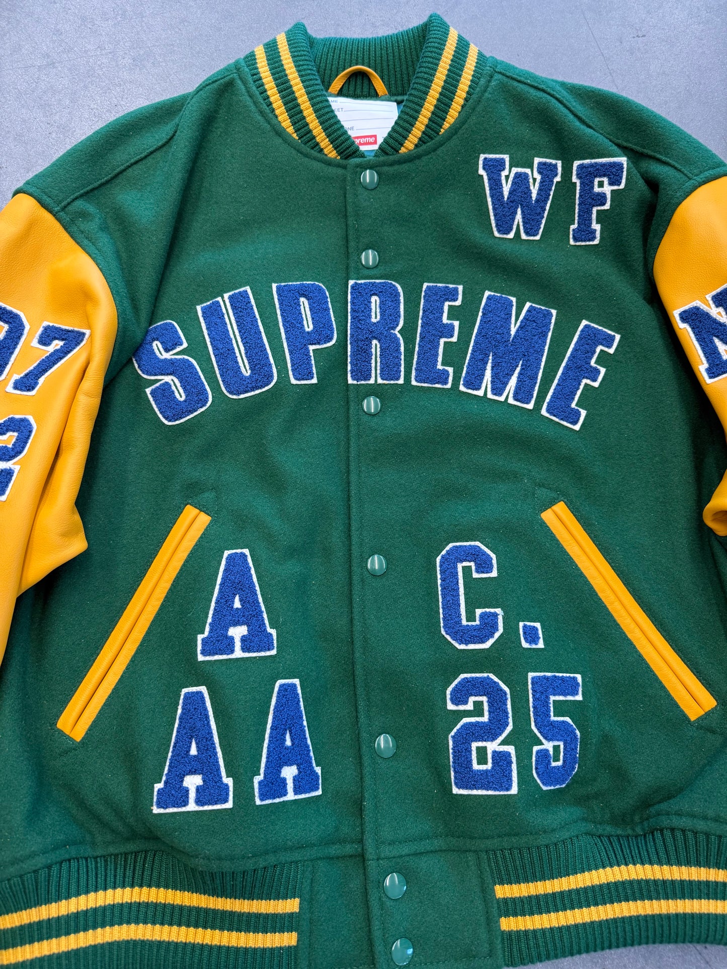 SS25 SUPREME PRAISES VARSITY JACKET - GREEN/YELLOW (NEW)