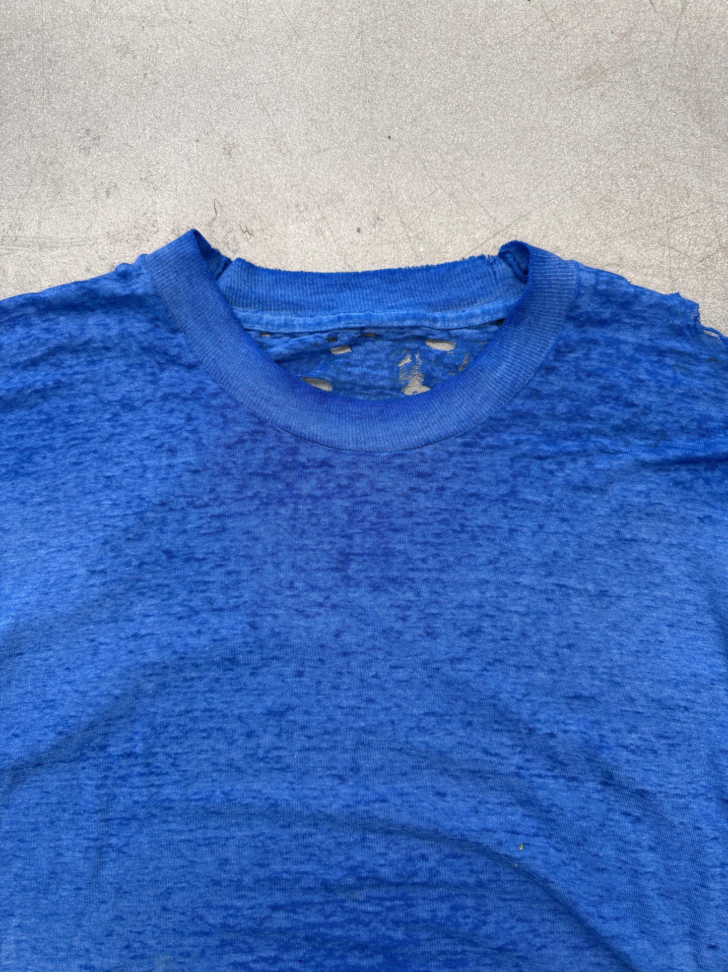 VINTAGE THRASHED THIN BLUE TEE WITH YELLOW LETTERS ON BACK (PULLED TAG)