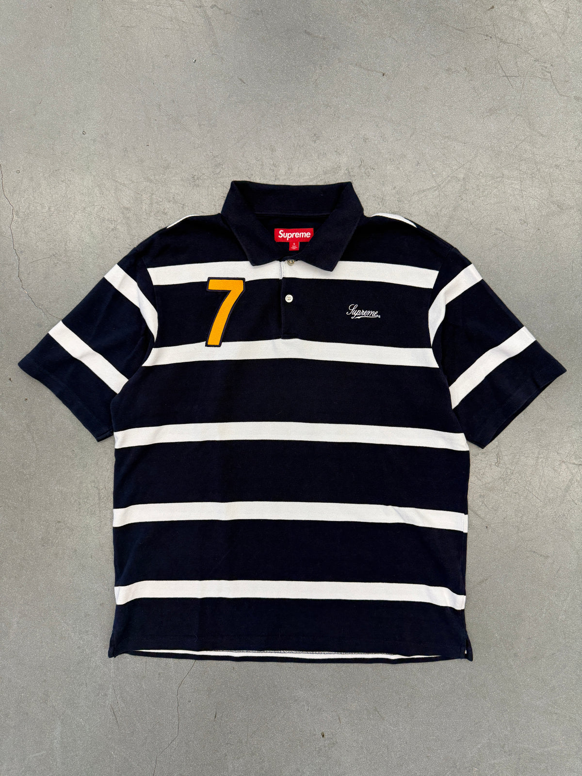 SS25 SUPREME CURSIVE POLO SHIRT - NAVY STRIPE