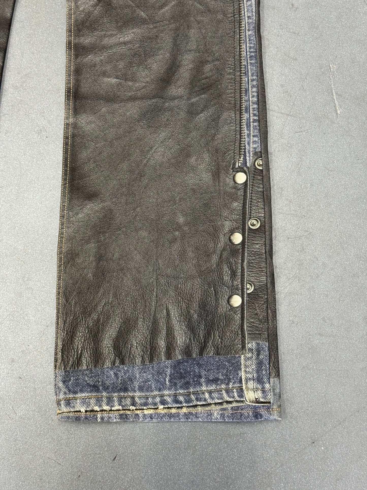 ACNE STUDIOS LEATHER CHAPS PRINTED JEANS