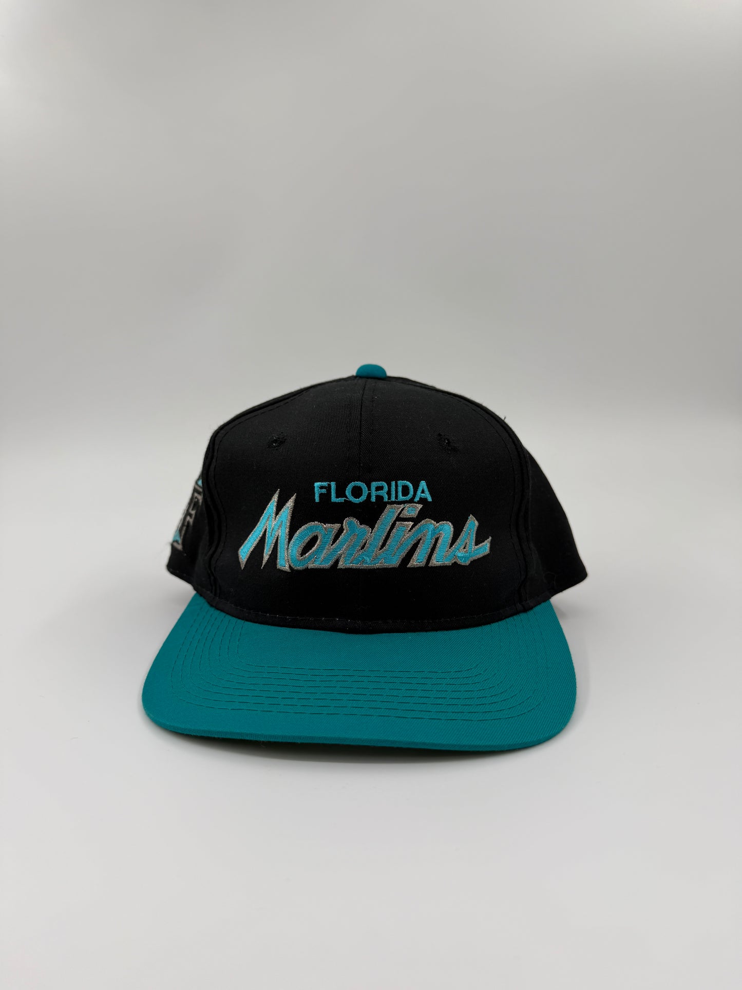 90S FLORIDA MARLINS SCRIPT THE TWILL SPORTS SPECIALTIES SNAPBACK HAT BLACK/TEAL