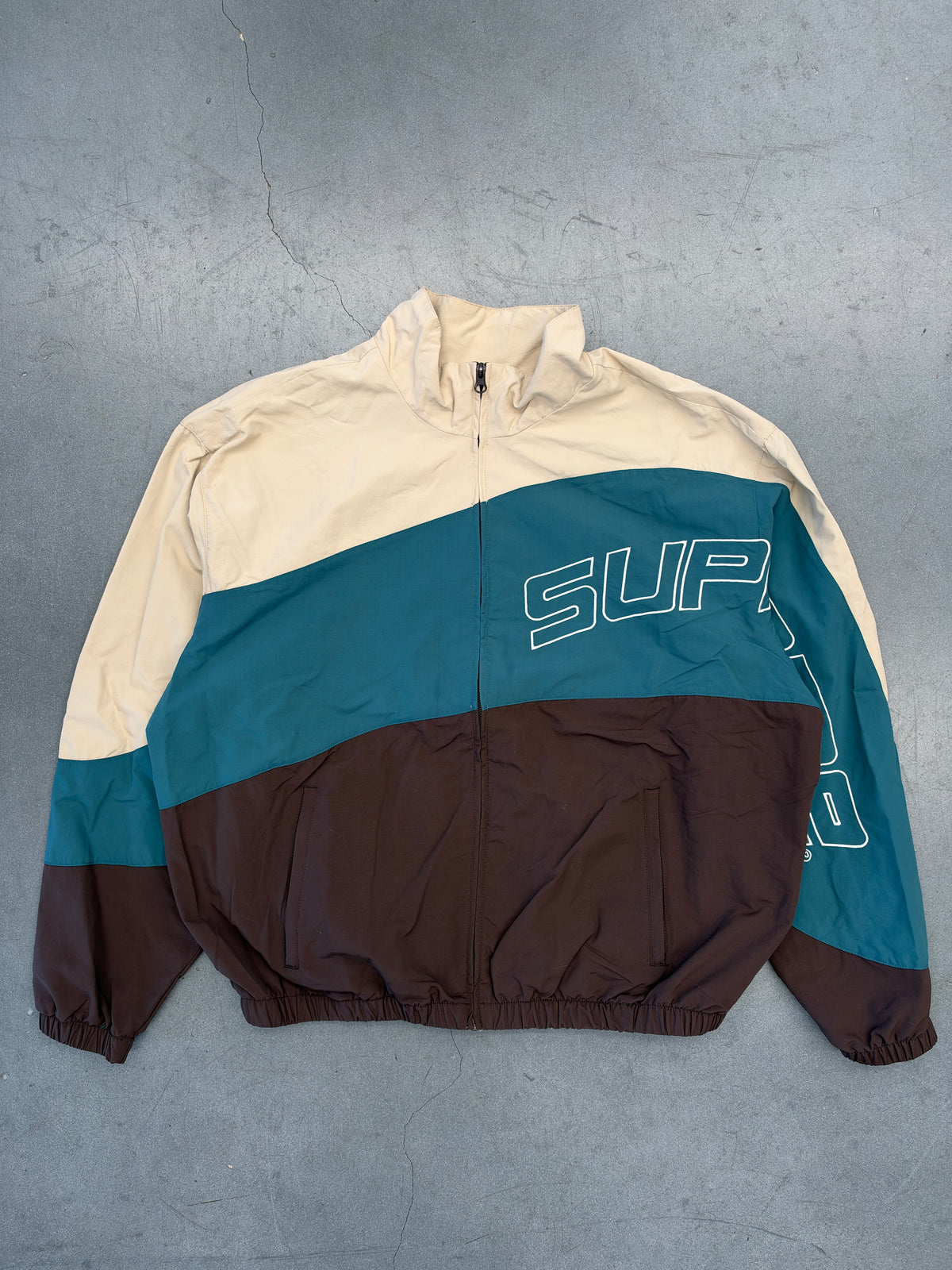 SS24 SUPREME CURVE TRACK JACKET - BROWN