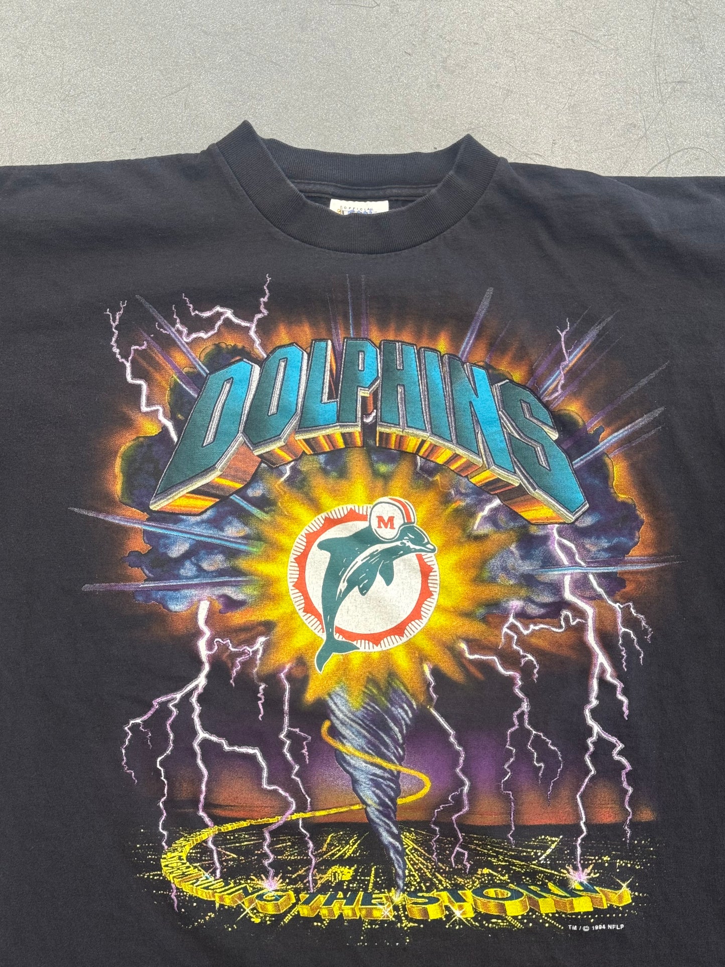 1994 MIAMI DOLPHINS RIDING THE STORM TEE (OFFICAL FAN SPORTSWEAR TAG)
