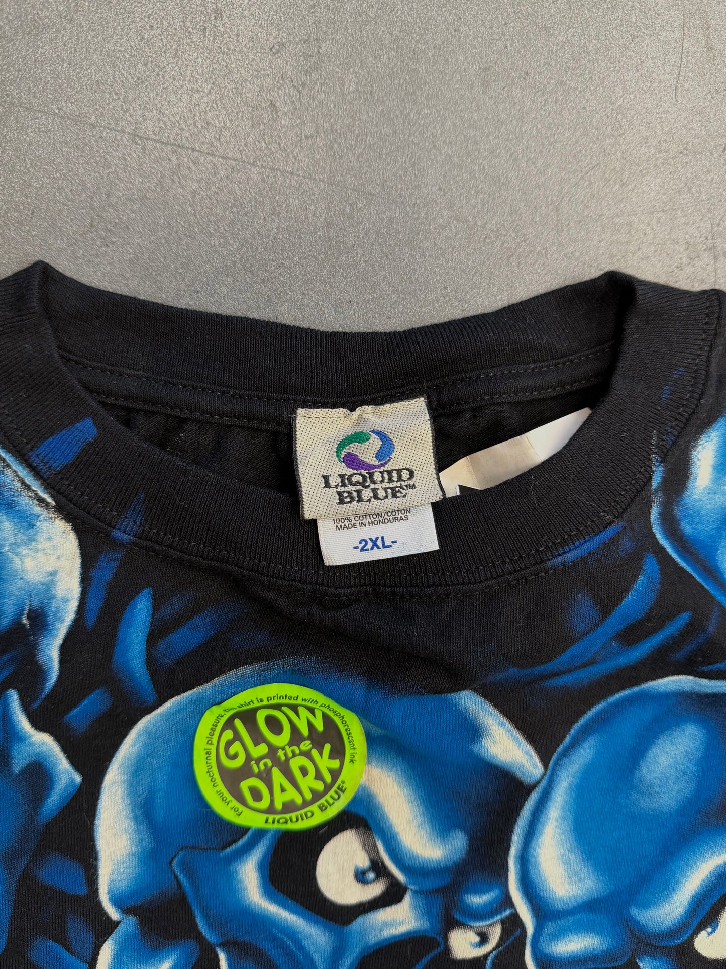 2001 LIQUID BLUE GLOW IN THE DARK SKULLS AOP TEE - BLUE (NWT)