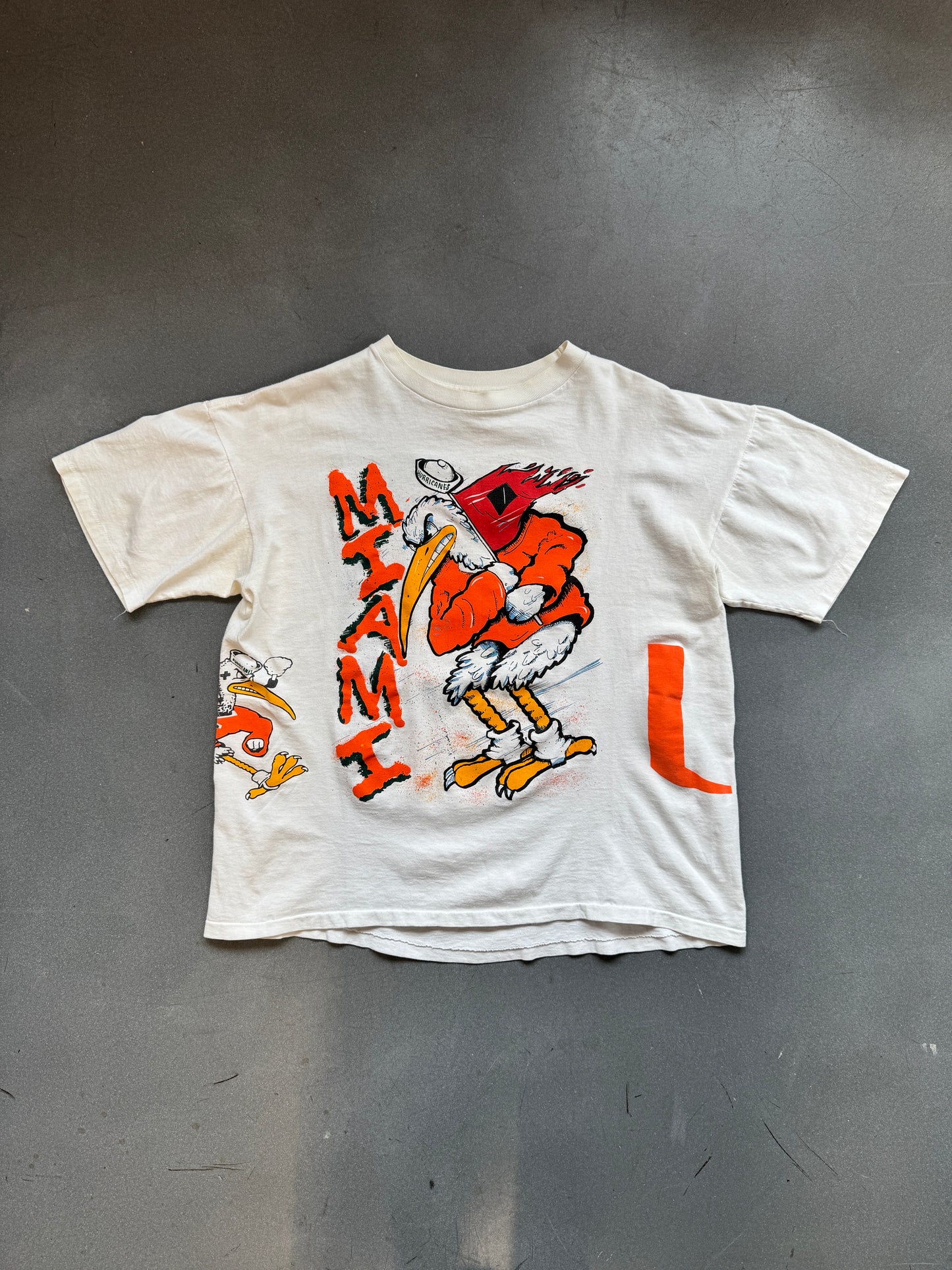 90'S UNIVERSITY OF MIAMI HURRICANES SEBASTIAN IBIS WRAP AROUND FOOTBALL #1 CANES TEE (FADED TAG)