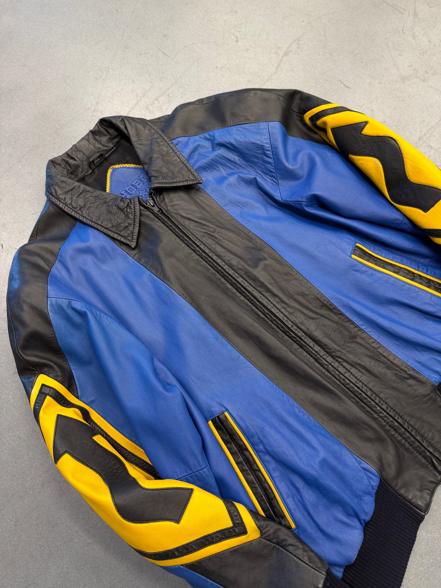 VINTAGE MICHAEL HOBAN NORTH BEACH STREET SIGN LEATHER JACKET - BLUE/YELLOW (S)