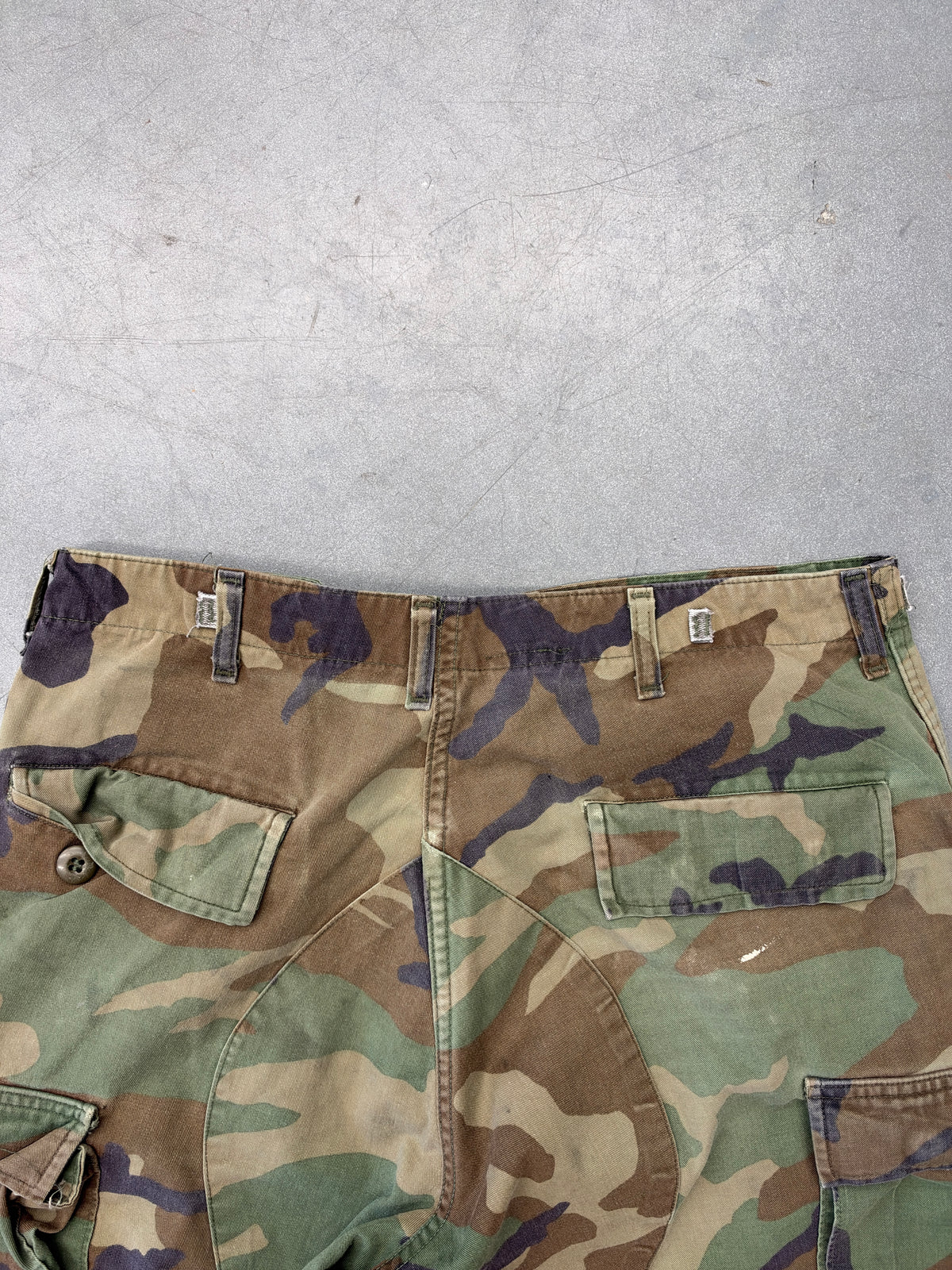 VINTAGE WOODLAND CAMO CARGO PANTS CUT TO LONG SHORTS (FADED TAG)