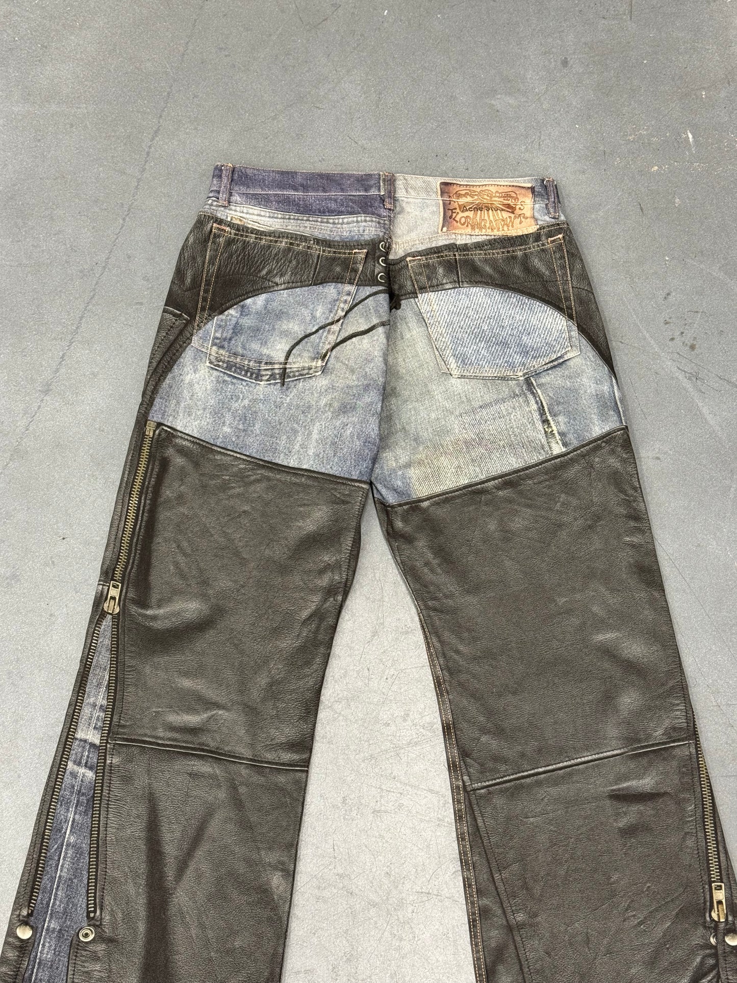 ACNE STUDIOS LEATHER CHAPS PRINTED JEANS