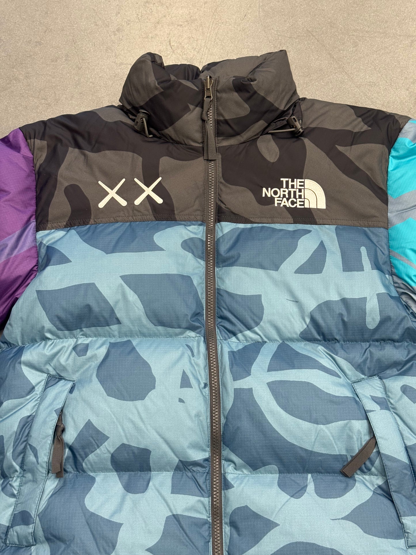 KAWS X THE NORTH FACE RETRO 1996 JACKET - MONTEREY BLUE NUPTSE PRINT