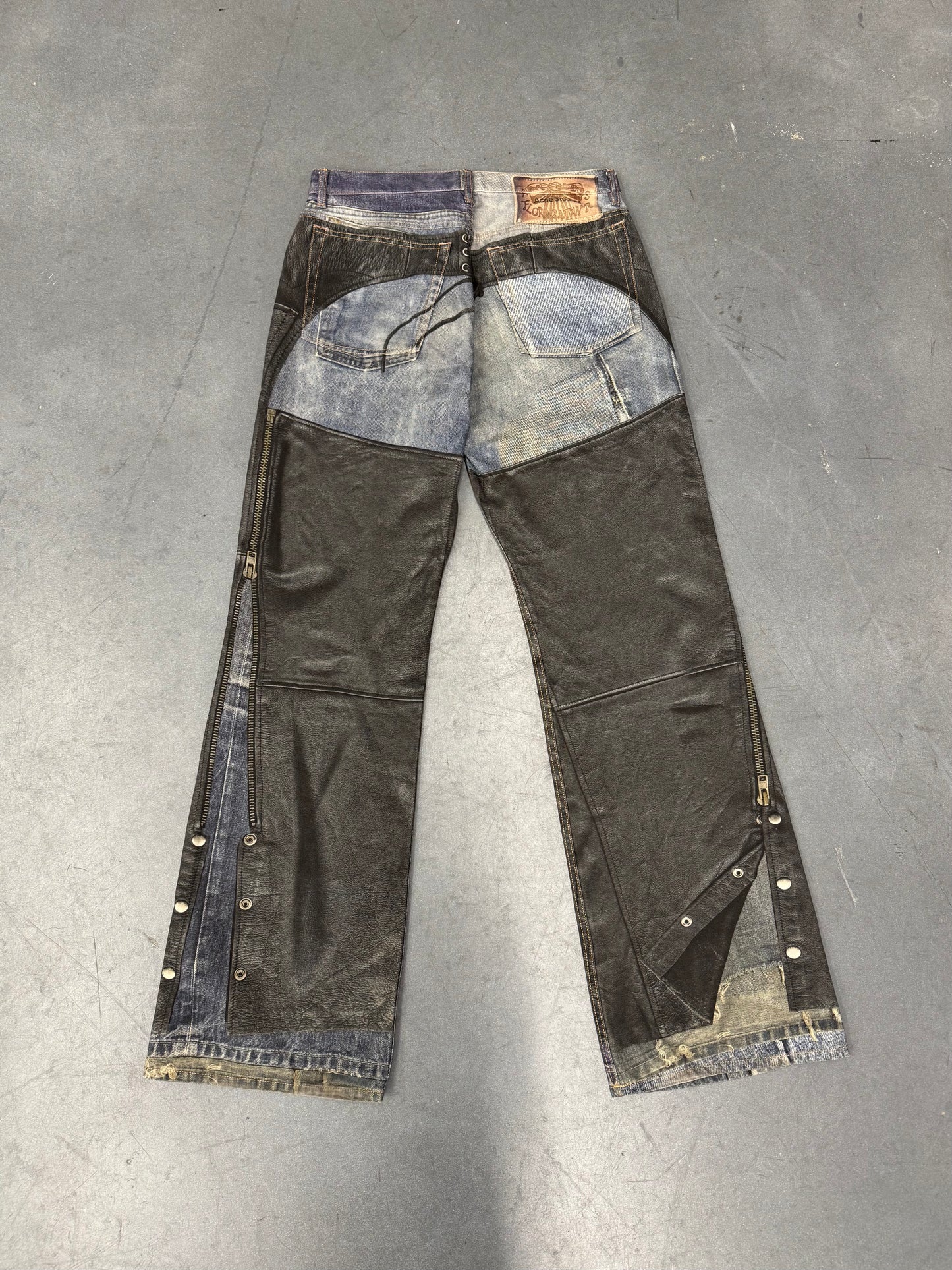 ACNE STUDIOS LEATHER CHAPS PRINTED JEANS