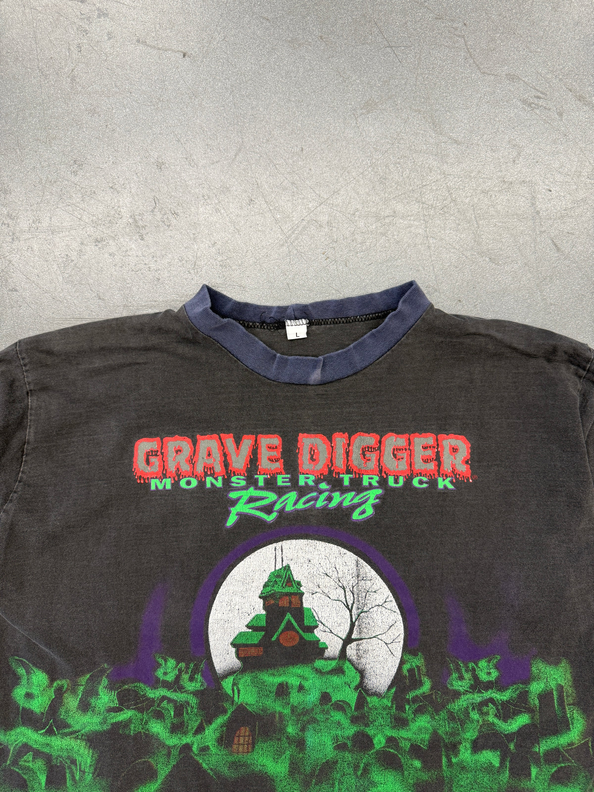 90'S GRAVE DIGGER MONSTER TRUCK RACING AOP LONG SLEEVE FADED TEE (L TAG)