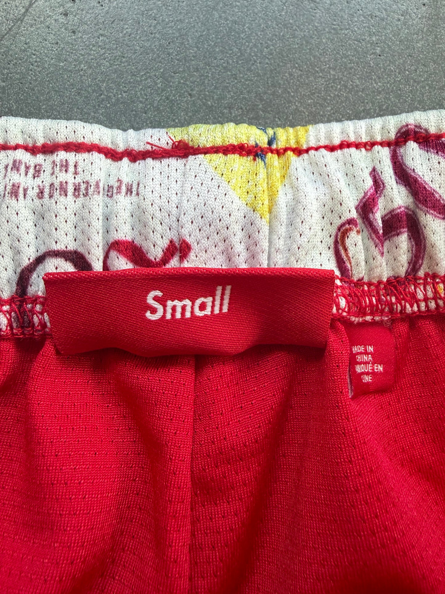 FW25 SUPREME POUNDS SOCCER SHORT - RED