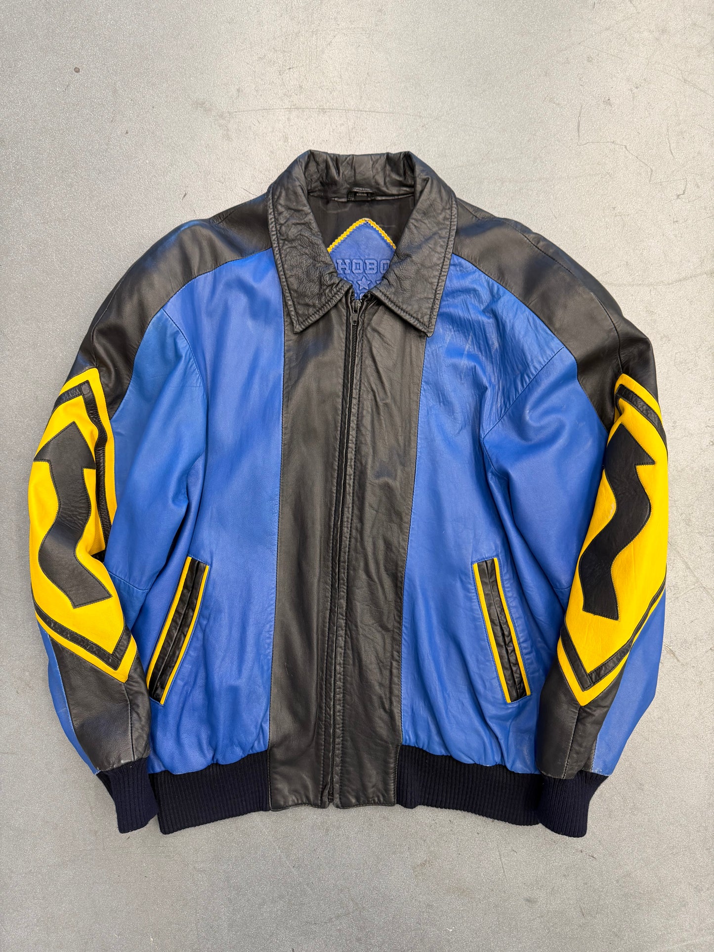 VINTAGE MICHAEL HOBAN NORTH BEACH STREET SIGN LEATHER JACKET - BLUE/YELLOW (S)