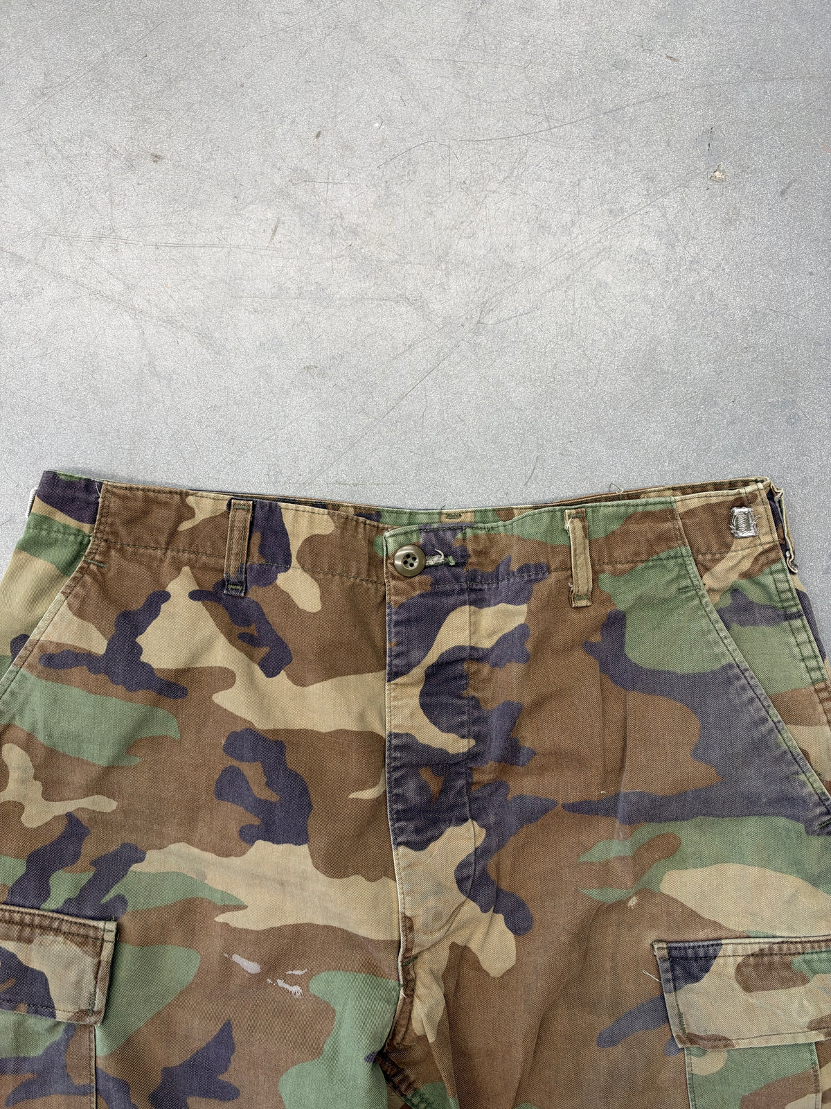 VINTAGE WOODLAND CAMO CARGO PANTS CUT TO LONG SHORTS (FADED TAG)
