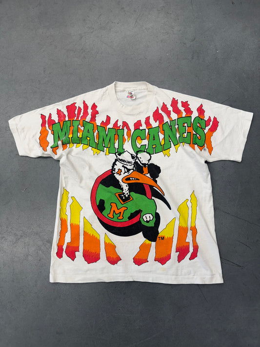 90S UNIVERSITY OF MIAMI SEBASTIAN CIRCLE LOGO FLAMES AOP TEE (FOTL TAG)