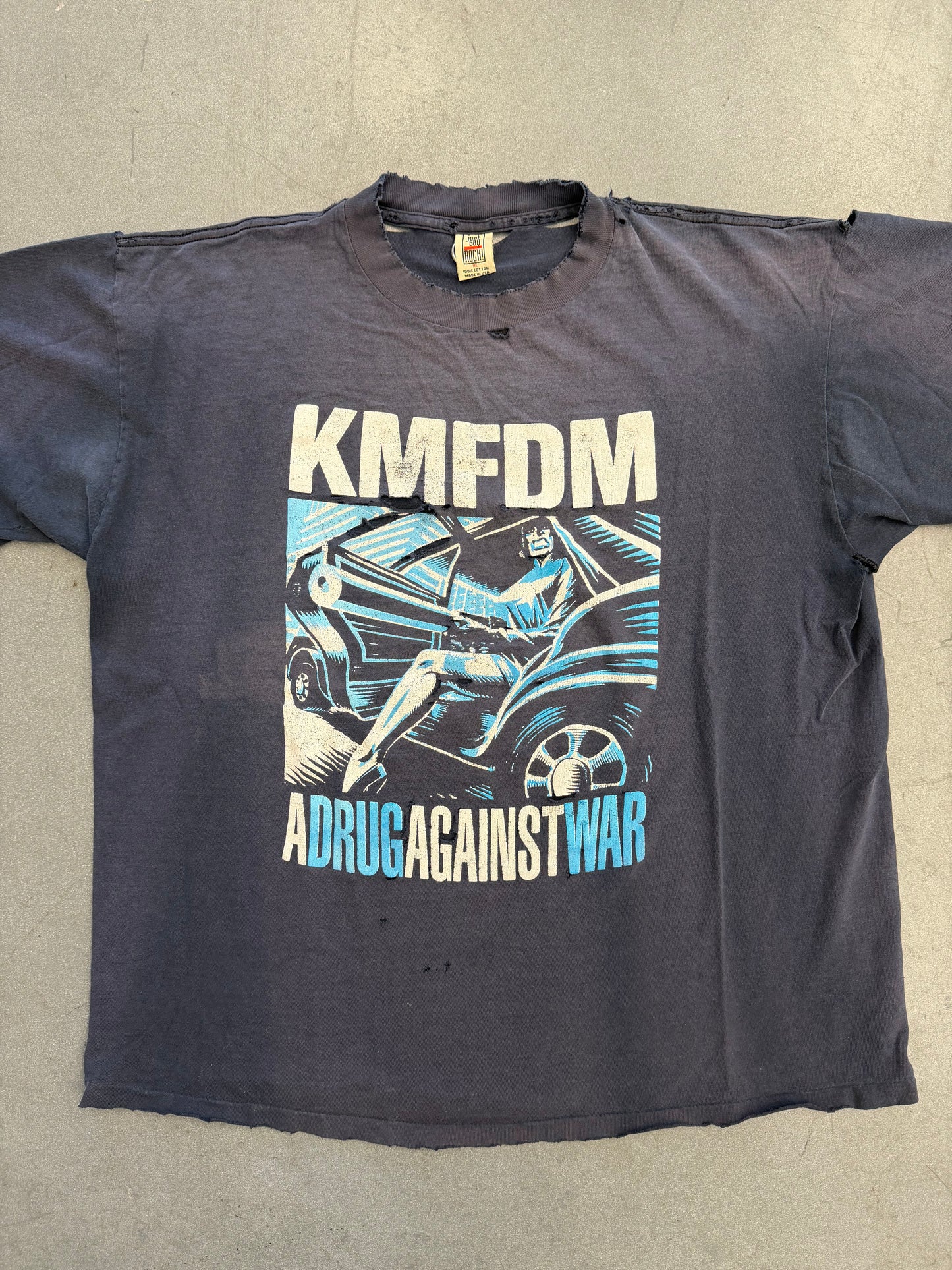 KMFDM A DRUG AGAINST WAR TEE (JUST SAY ROCK TAG)