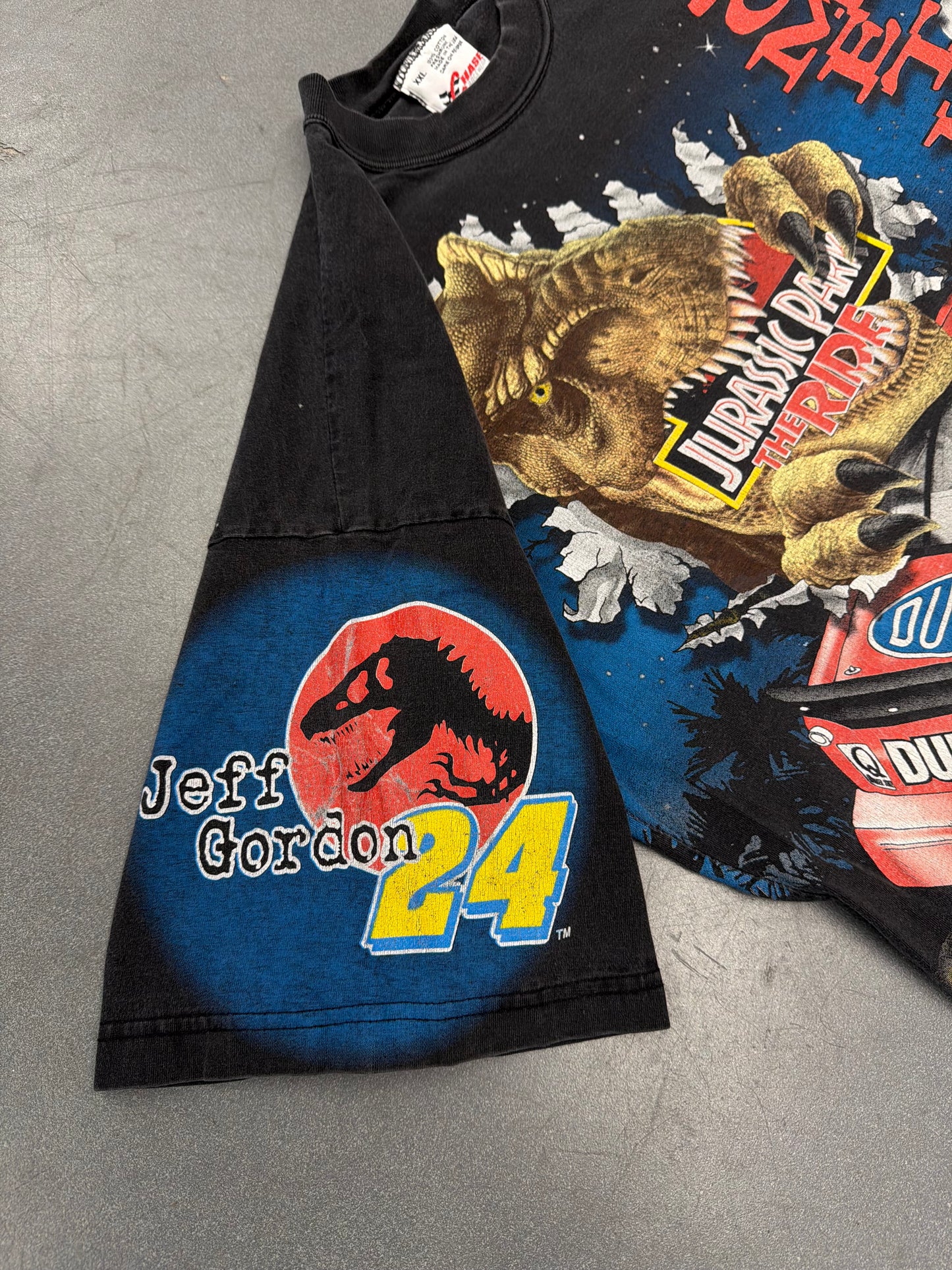 1997 JEFF GORDON JURASSIC PARK THE RIDE SOMETHING HAS SURVIVED AOP (CHASE RACE WEAR TAG)