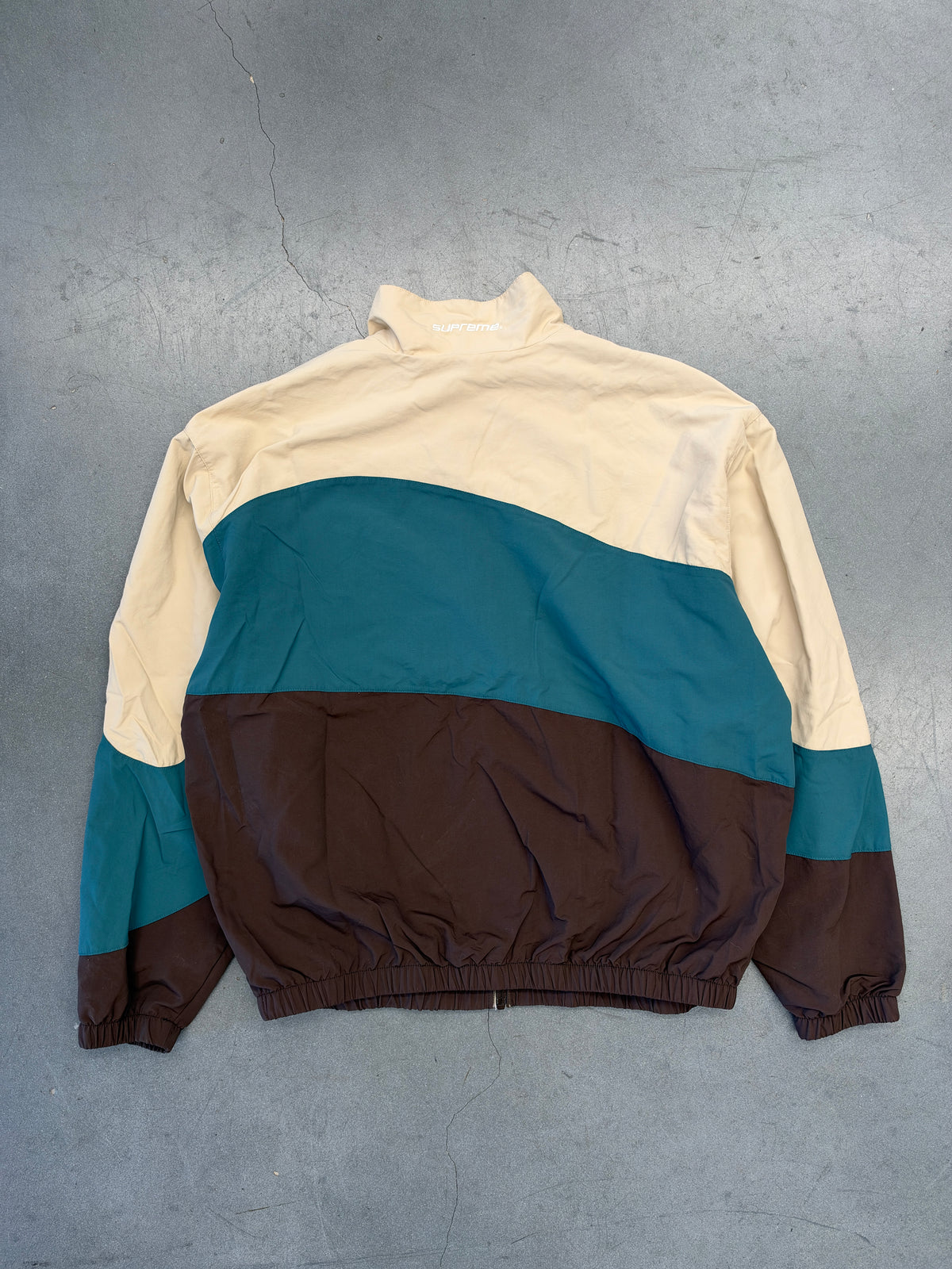 SS24 SUPREME CURVE TRACK JACKET - BROWN
