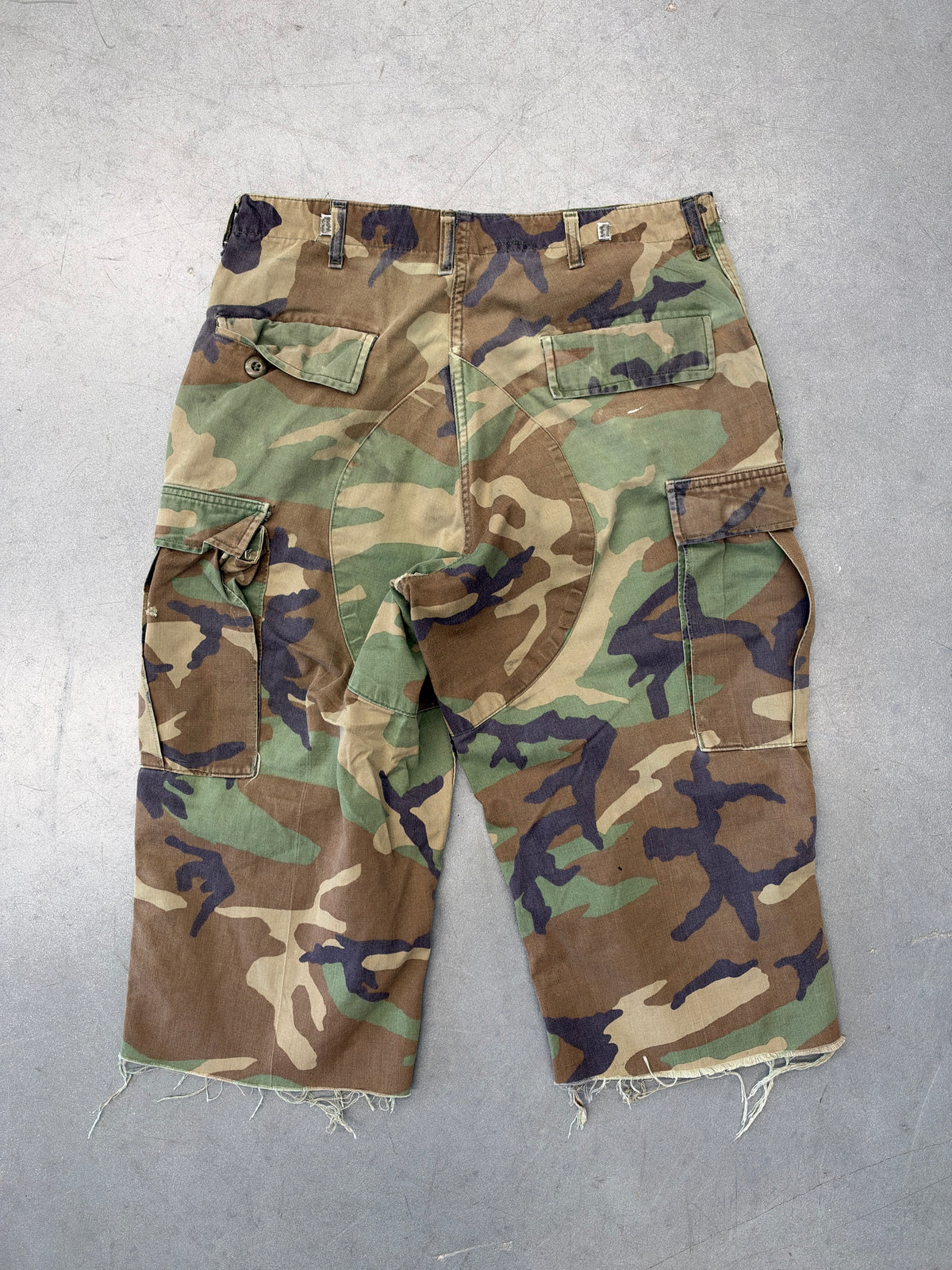 VINTAGE WOODLAND CAMO CARGO PANTS CUT TO LONG SHORTS (FADED TAG)