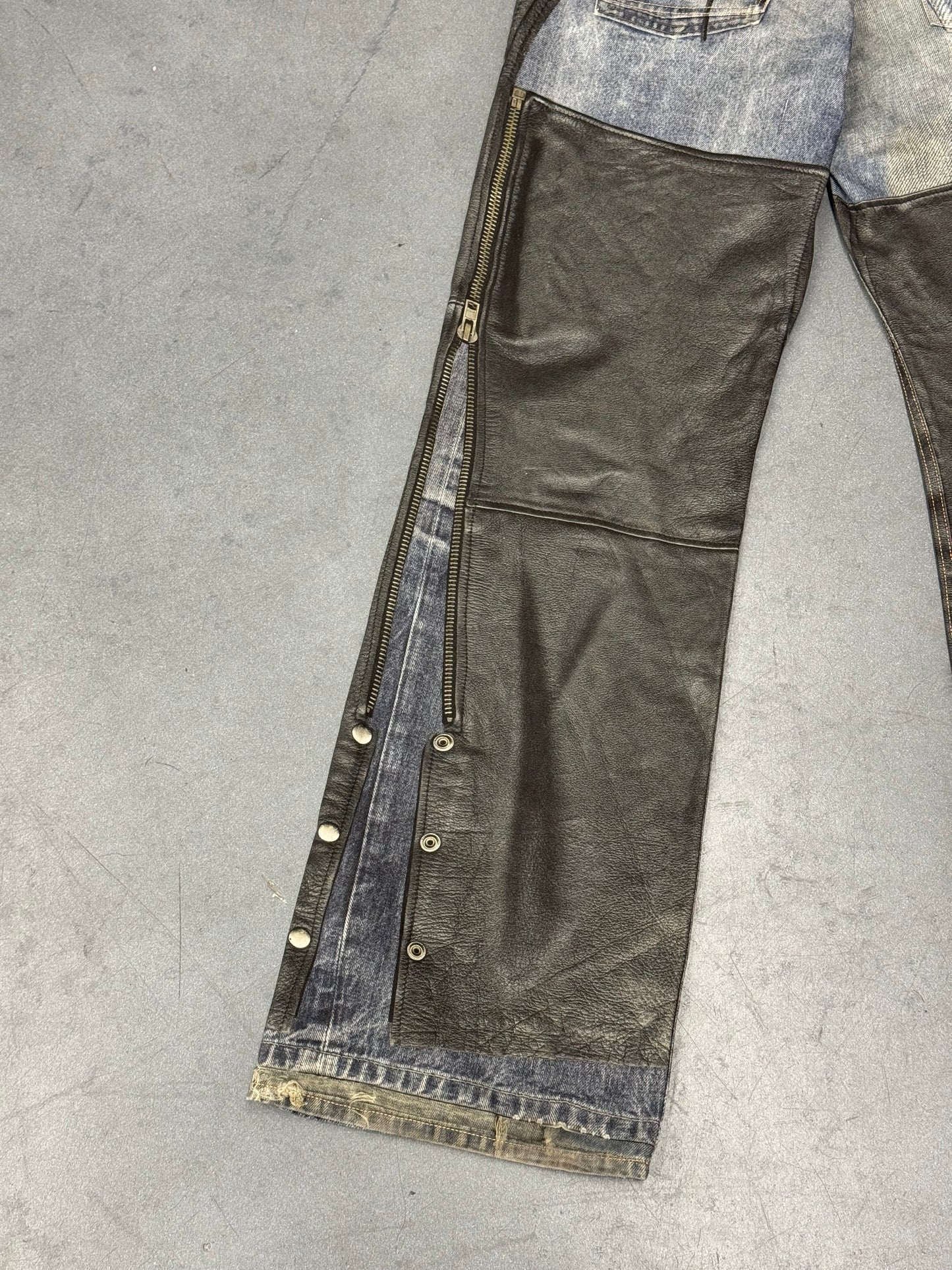 ACNE STUDIOS LEATHER CHAPS PRINTED JEANS