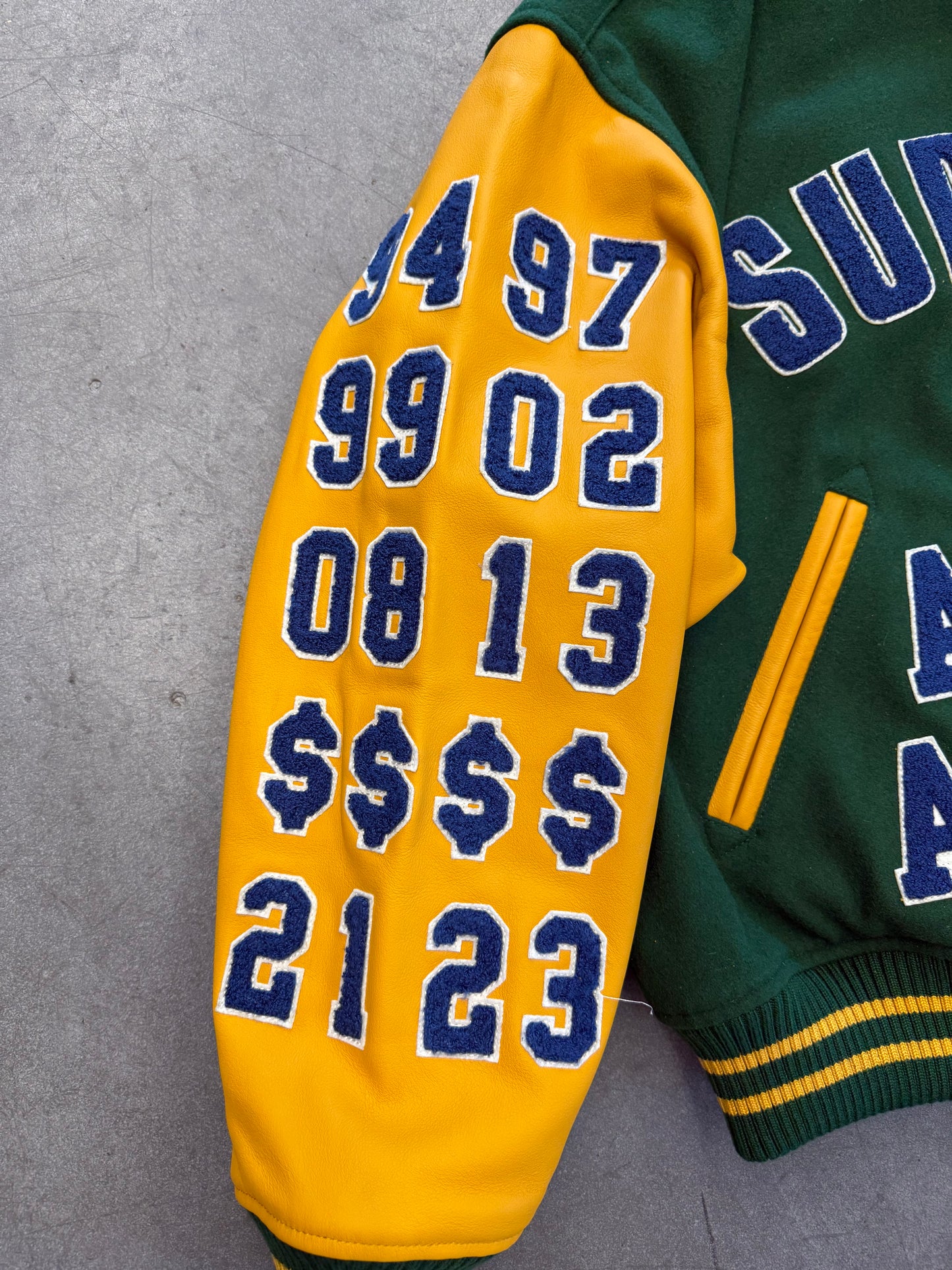 SS25 SUPREME PRAISES VARSITY JACKET - GREEN/YELLOW (NEW)