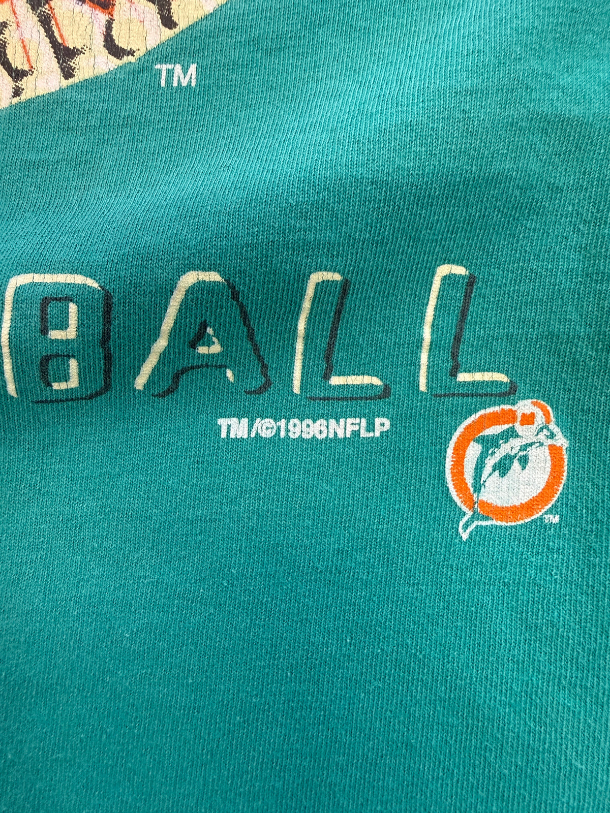 1996 MIAMI DOLPHINS FOOTBALL TEXTURE AND LACE PRINT LOGO "REAL FOOTBALL" TEE (COLLEGE CONCEPTS TAG)
